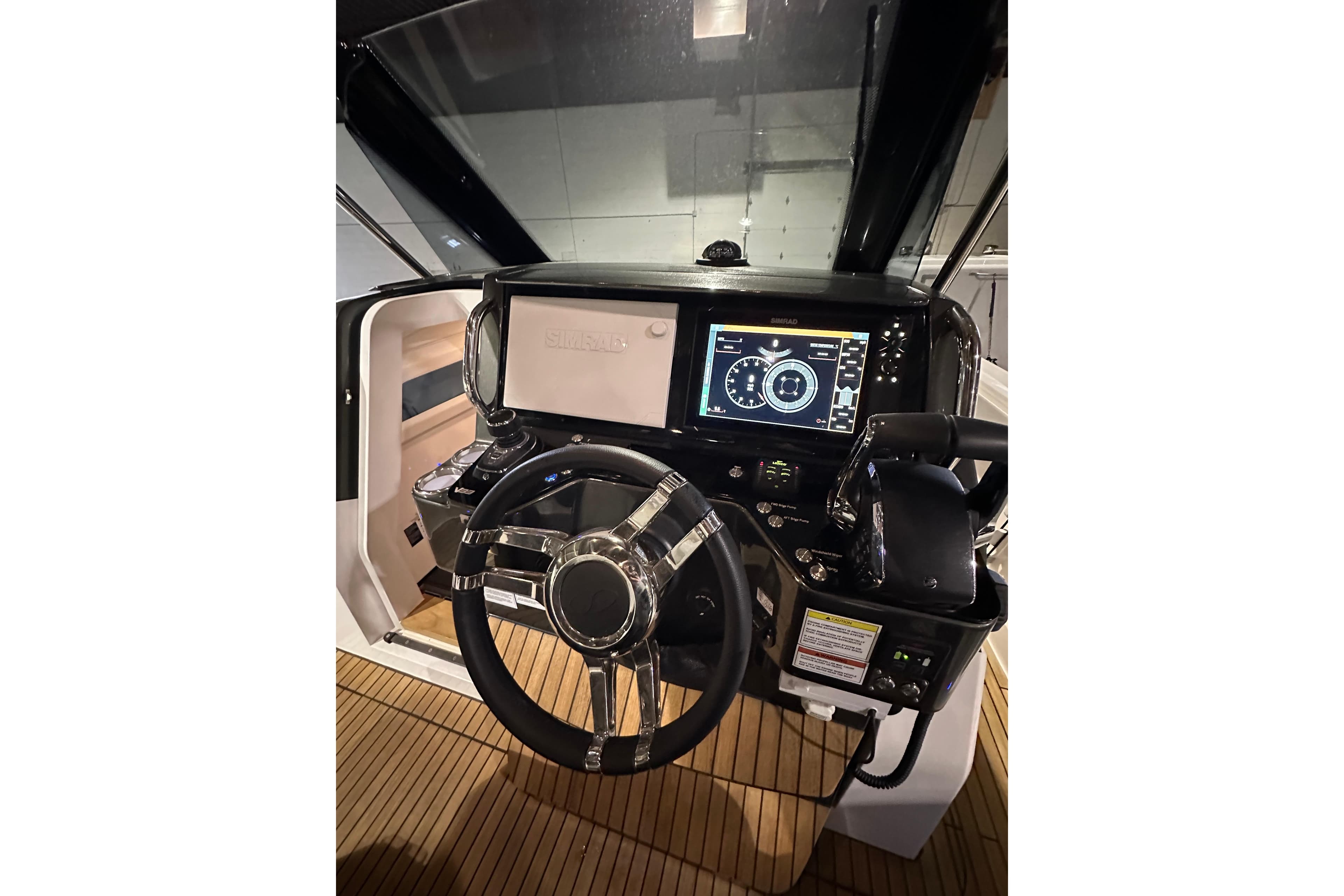 2024 Schaefer V33 helm with modern navigation display and sleek steering wheel design.