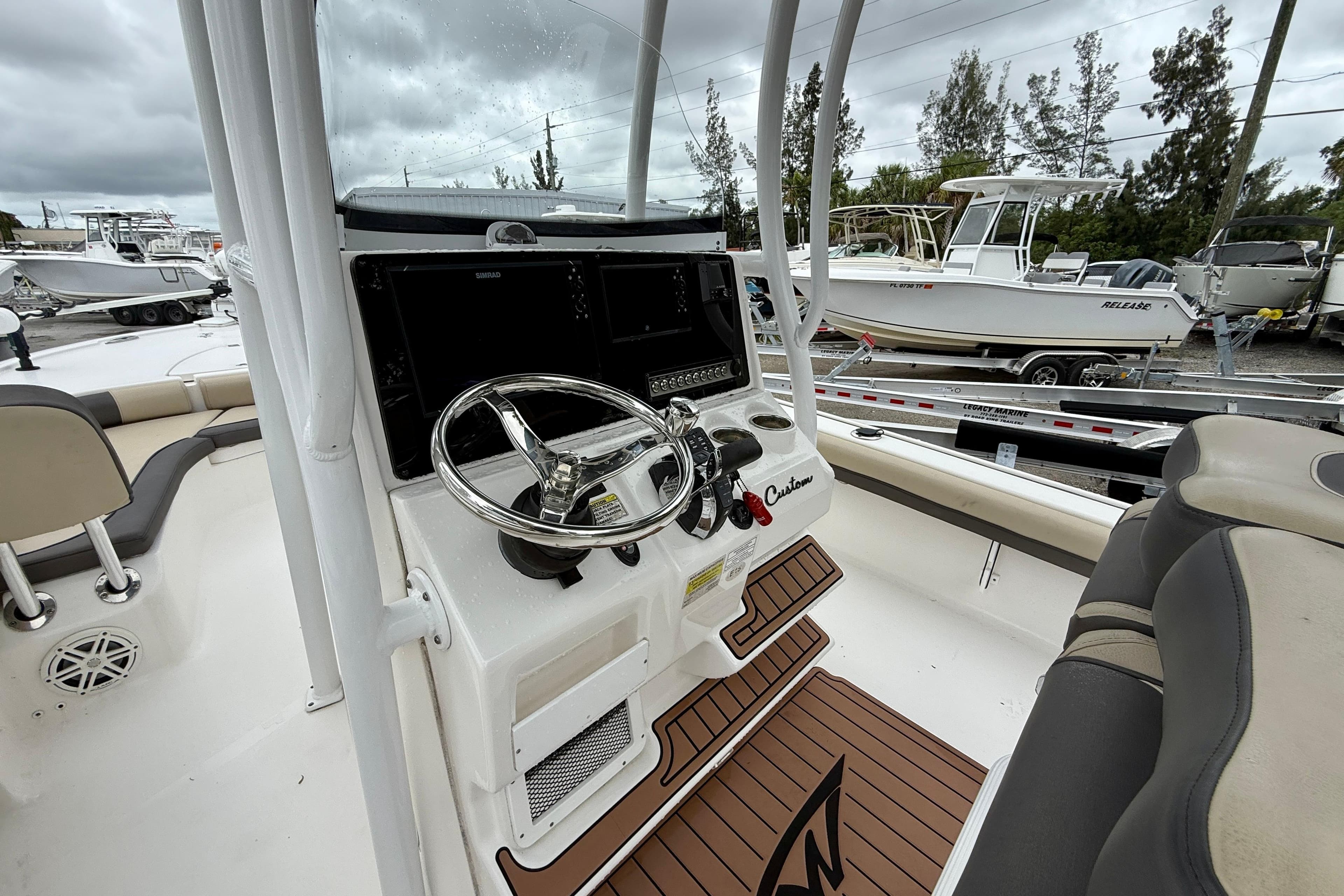 2020 Tidewater 2500 Carolina Bay boat interior with steering wheel and console.