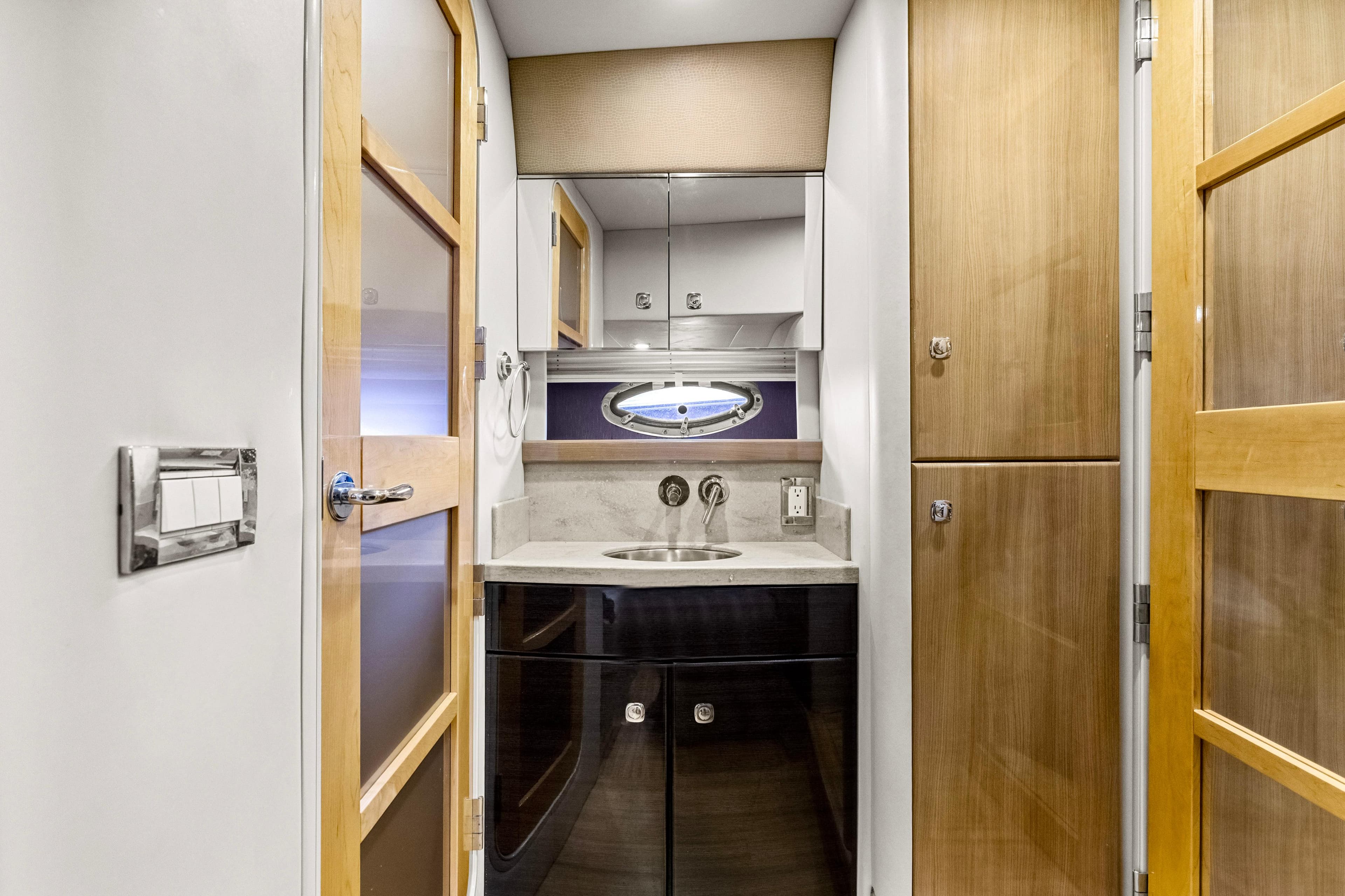 Luxurious bathroom interior of 2016 Formula 45 Yacht with modern fixtures and wooden accents.