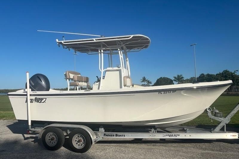 2018 Parker 2100 SE boat on trailer under clear blue sky.