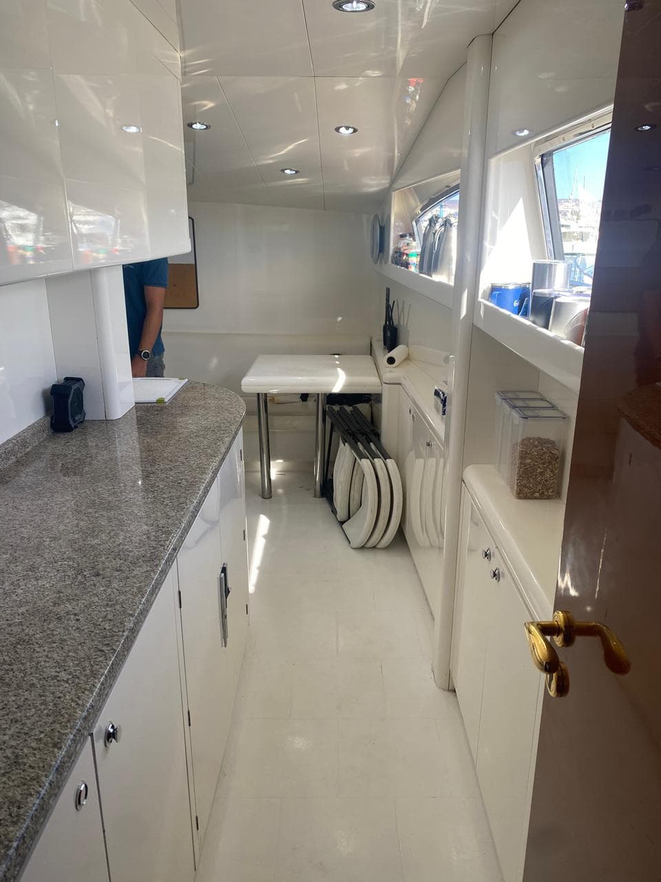 Luxurious interior of 1998 Azimut 90/100 Jumbo Motoryacht with sleek countertops and modern design.