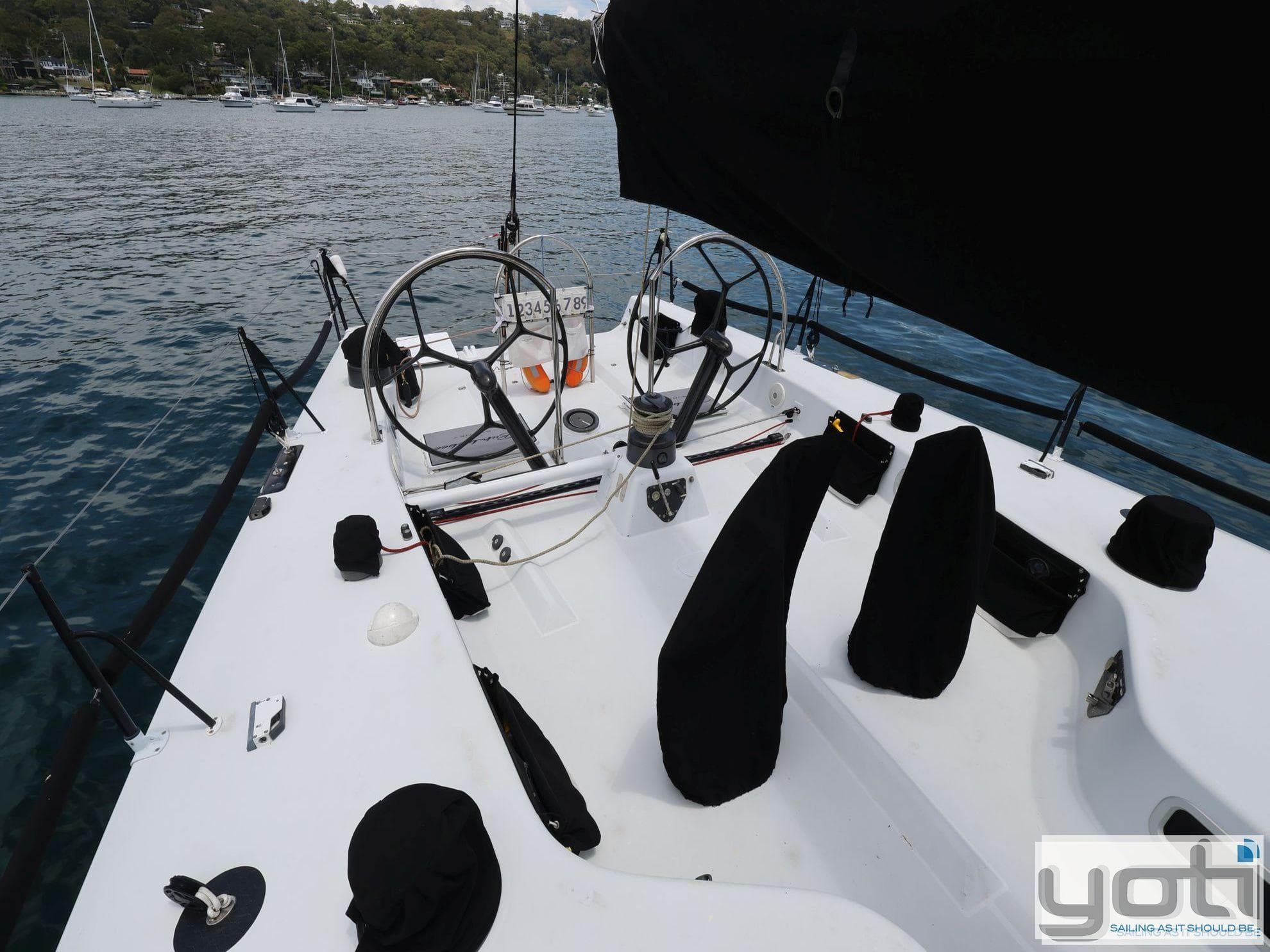 Sailing yacht cockpit with dual steering wheels, Custom Murray Burns Dovell 62, 1999 model.