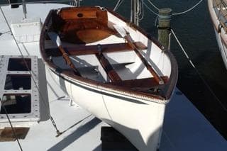 1985 Gozzard PILGRIM sailboat with wooden interior, docked at a marina.