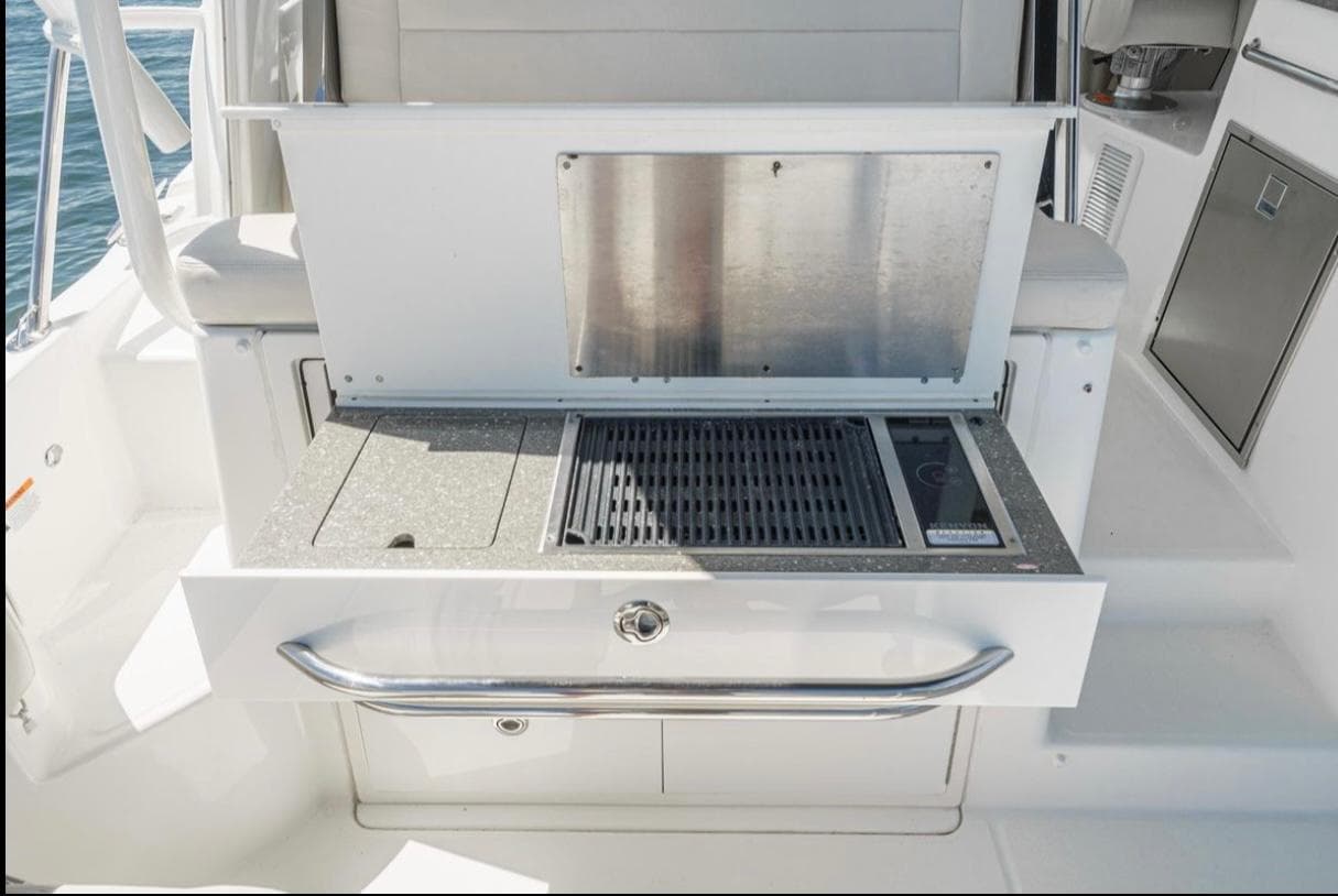 Outdoor grill station on a 2019 Boston Whaler 345 Conquest boat.