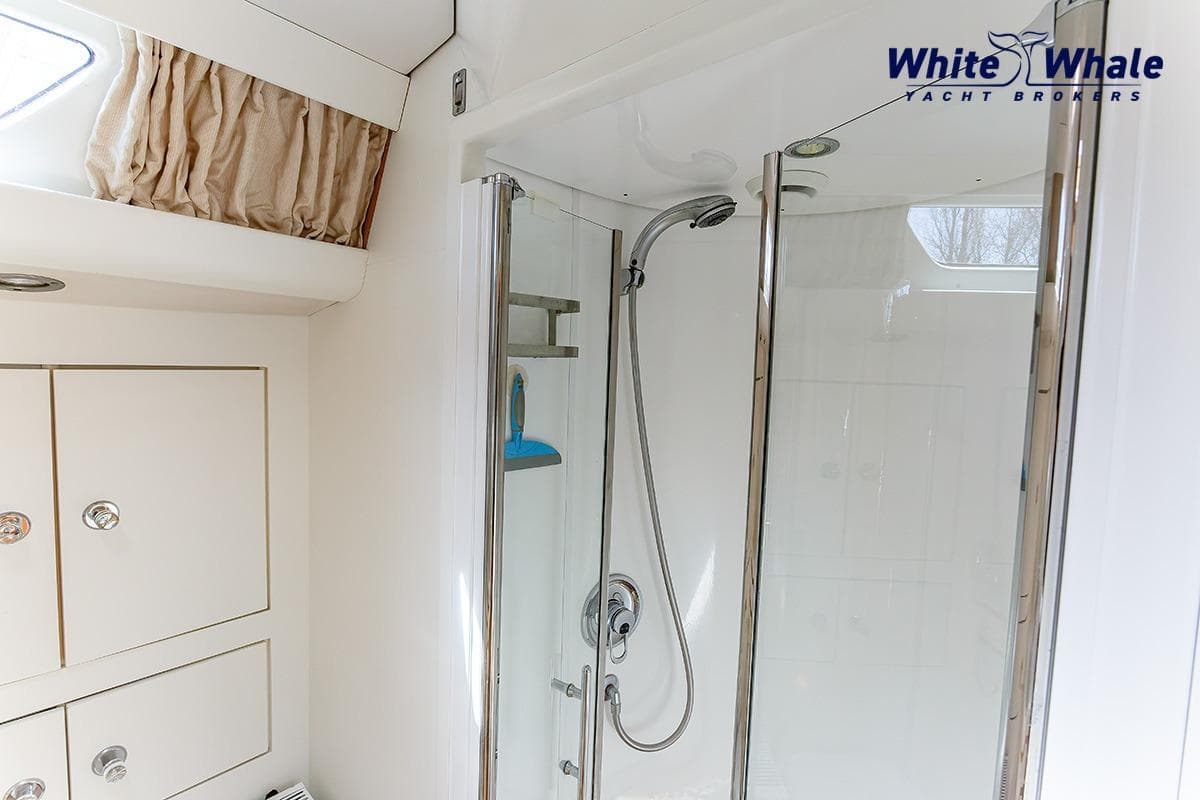 Luxurious bathroom in 1989 Dubbel & Jesse Nordsee 55 yacht with modern shower.