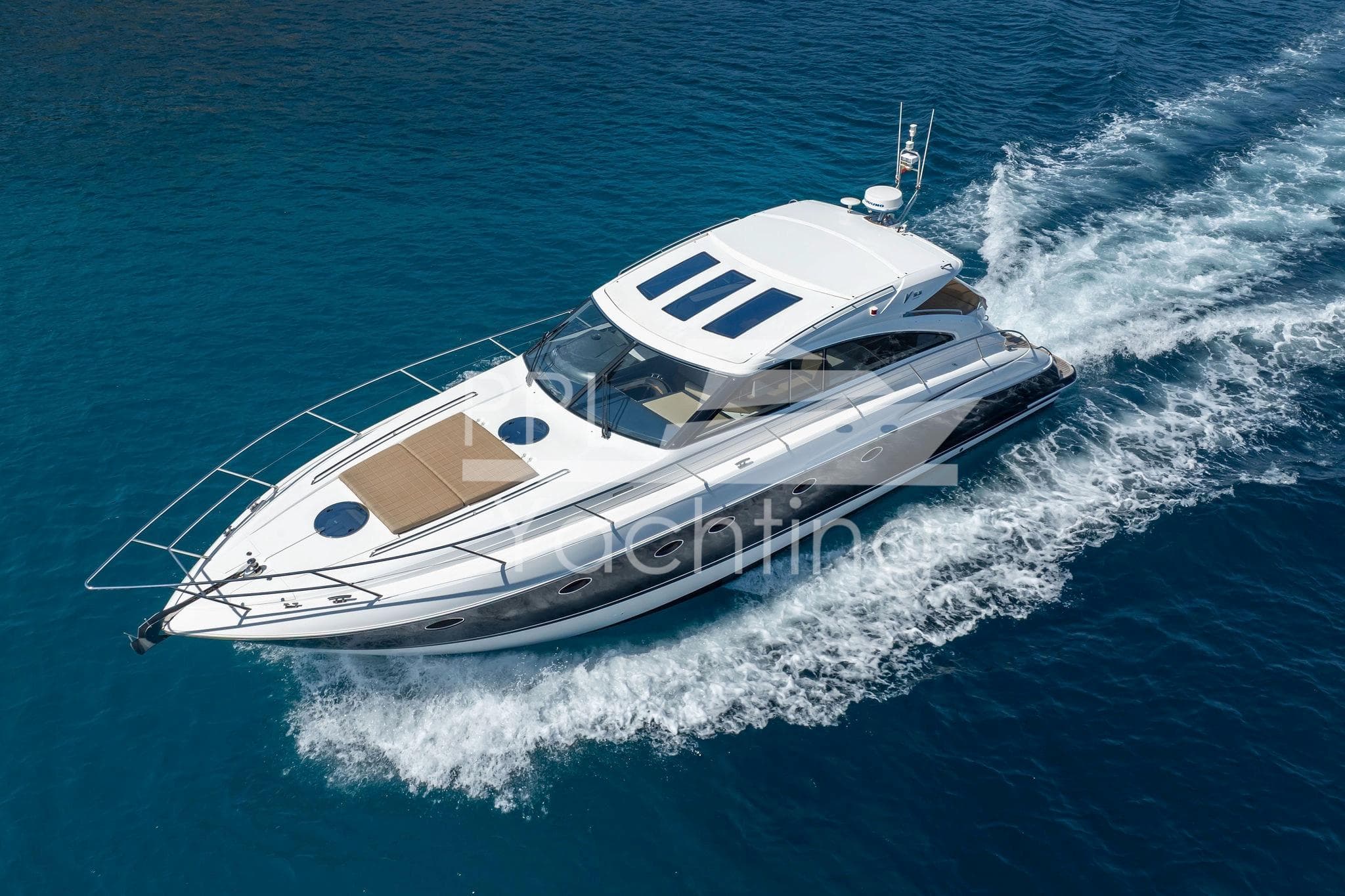 2006 Princess V53 yacht cruising on clear blue water.