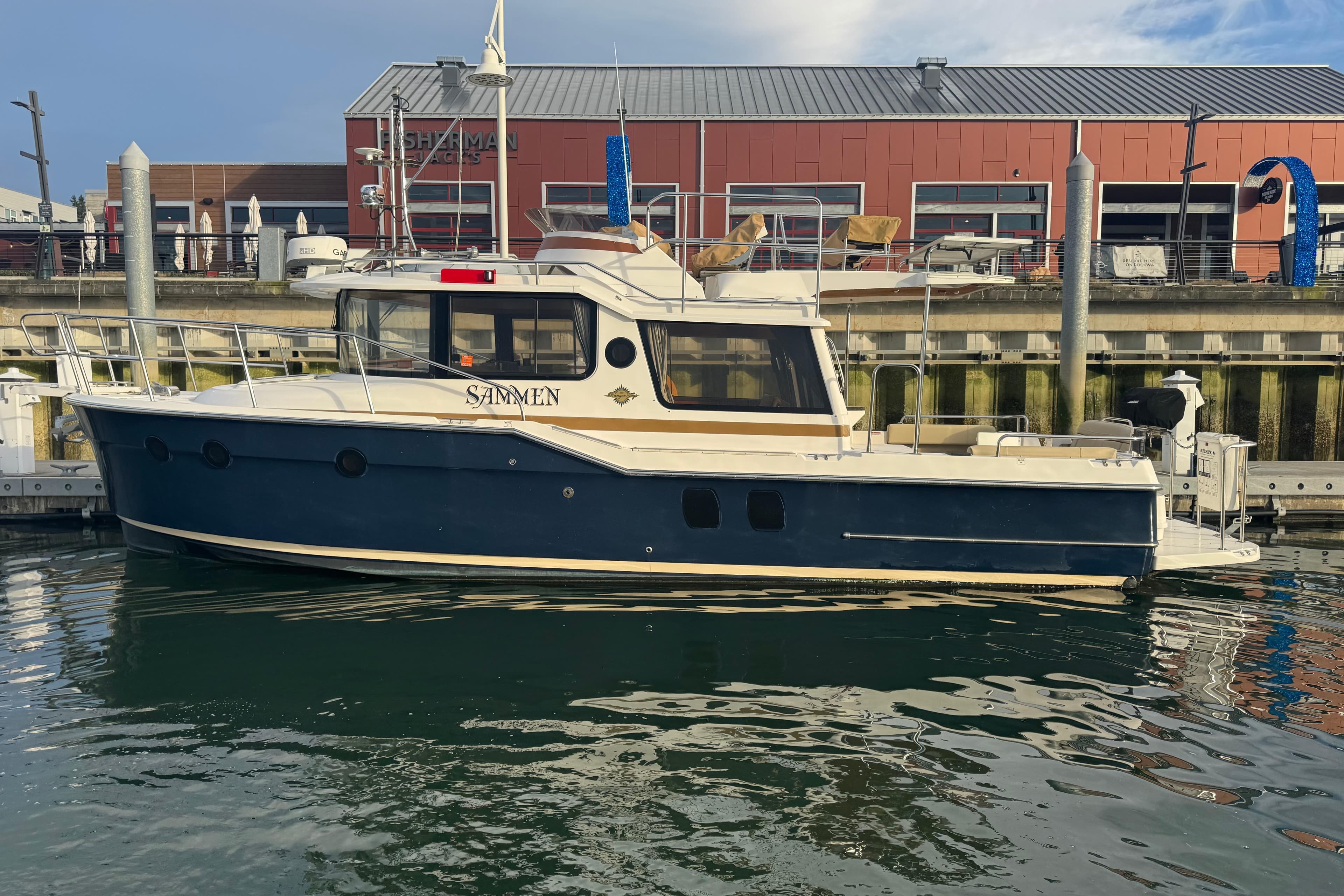 2019 Ranger Tugs R-29 CB boat docked at marina, side view.