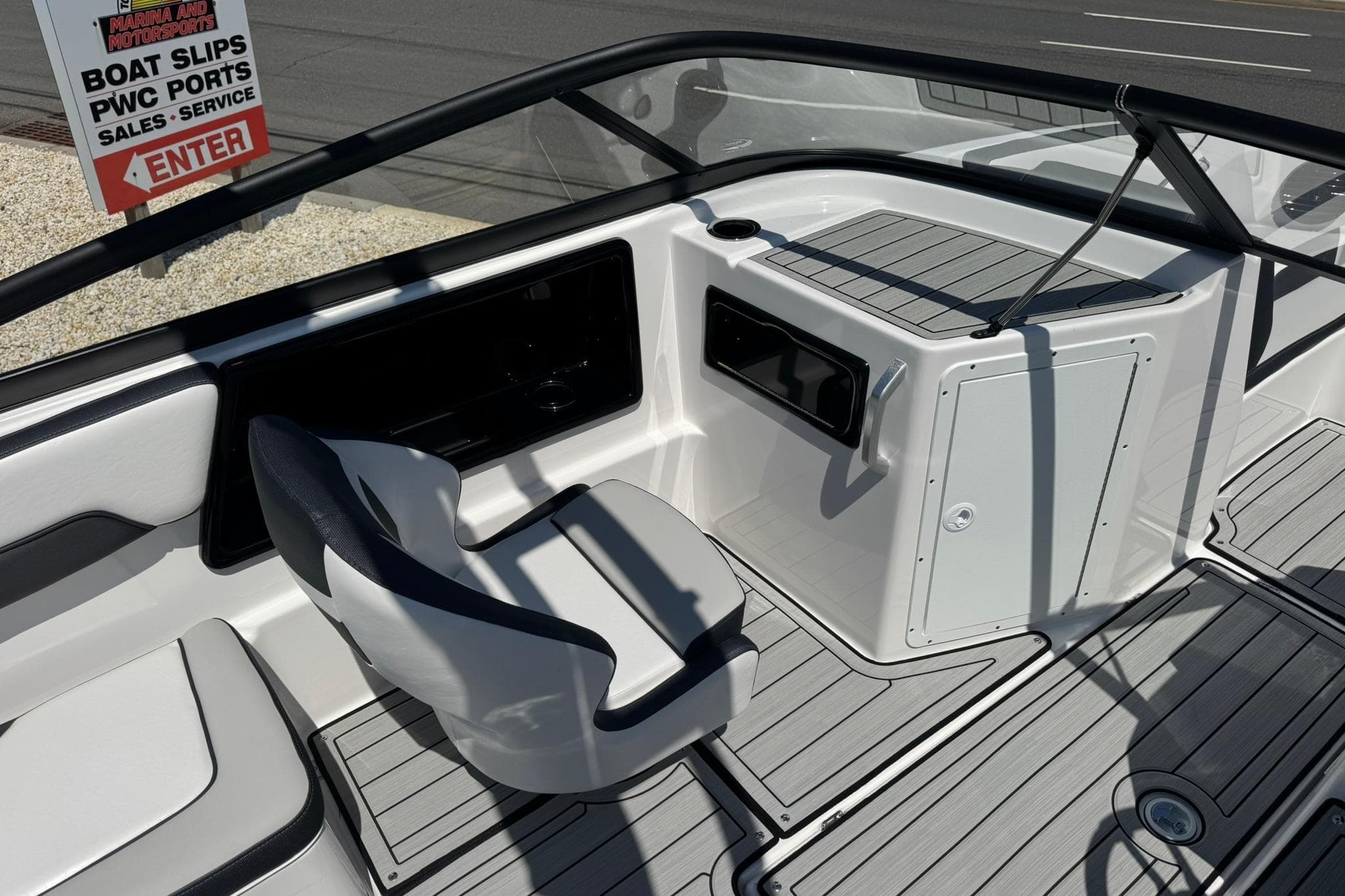 Interior view of 2026 Yamaha Boats 195S, featuring seating and dashboard details.