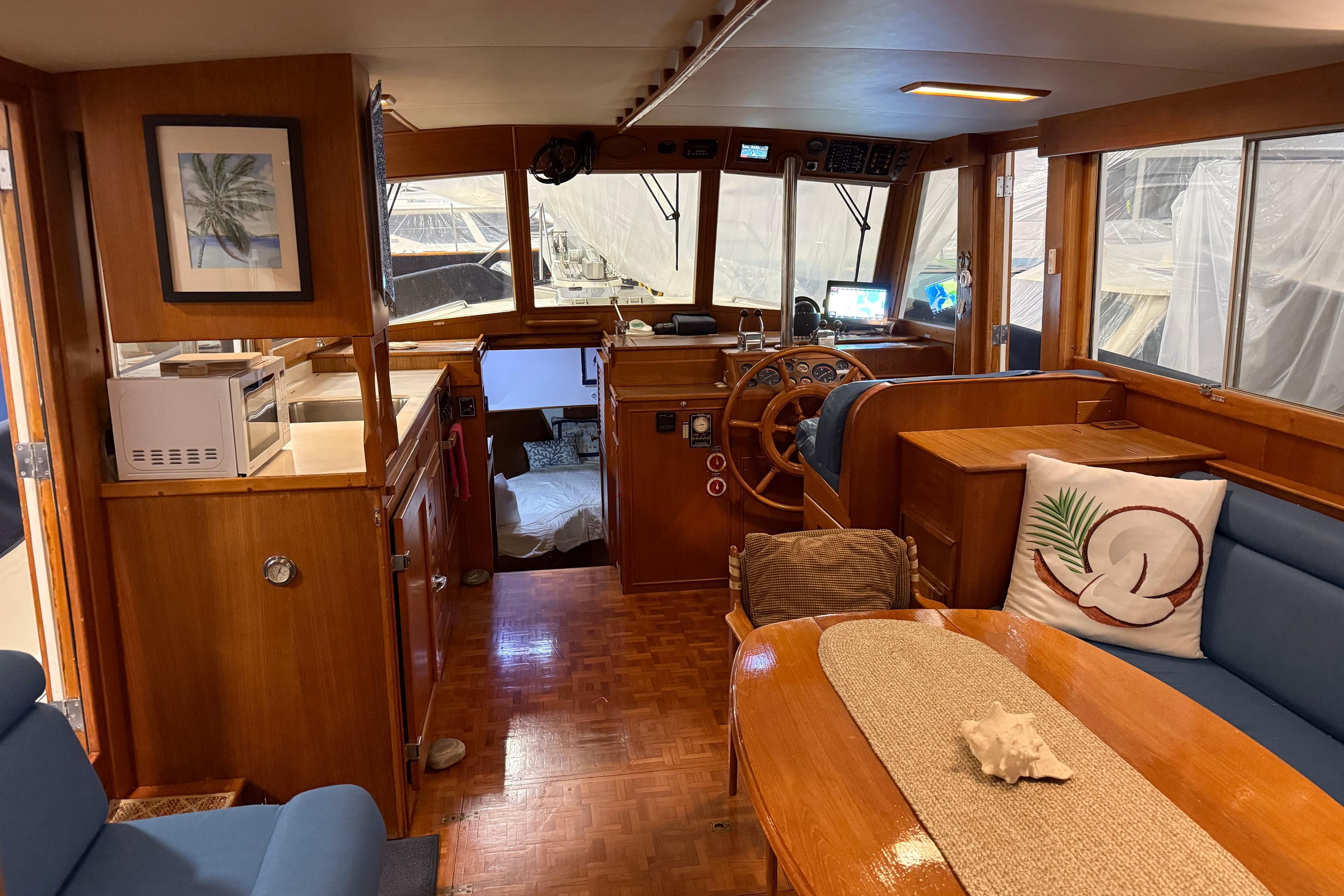 Interior of 1991 Grand Banks 42 Classic yacht with wooden furnishings and cozy seating area.