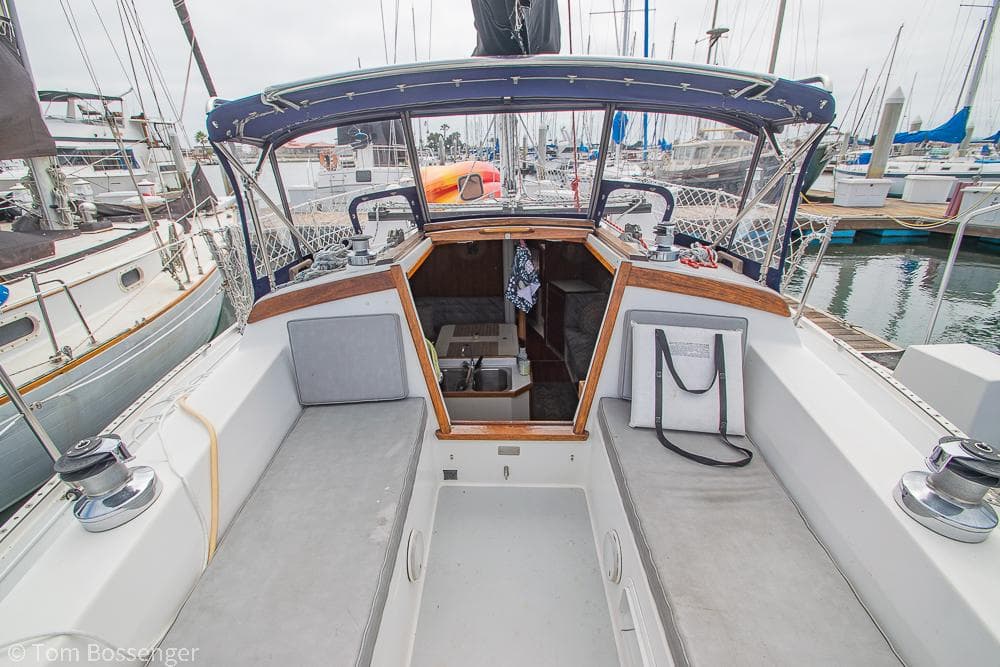 1992 Catalina 36 sailboat cockpit with open cabin, docked at marina.