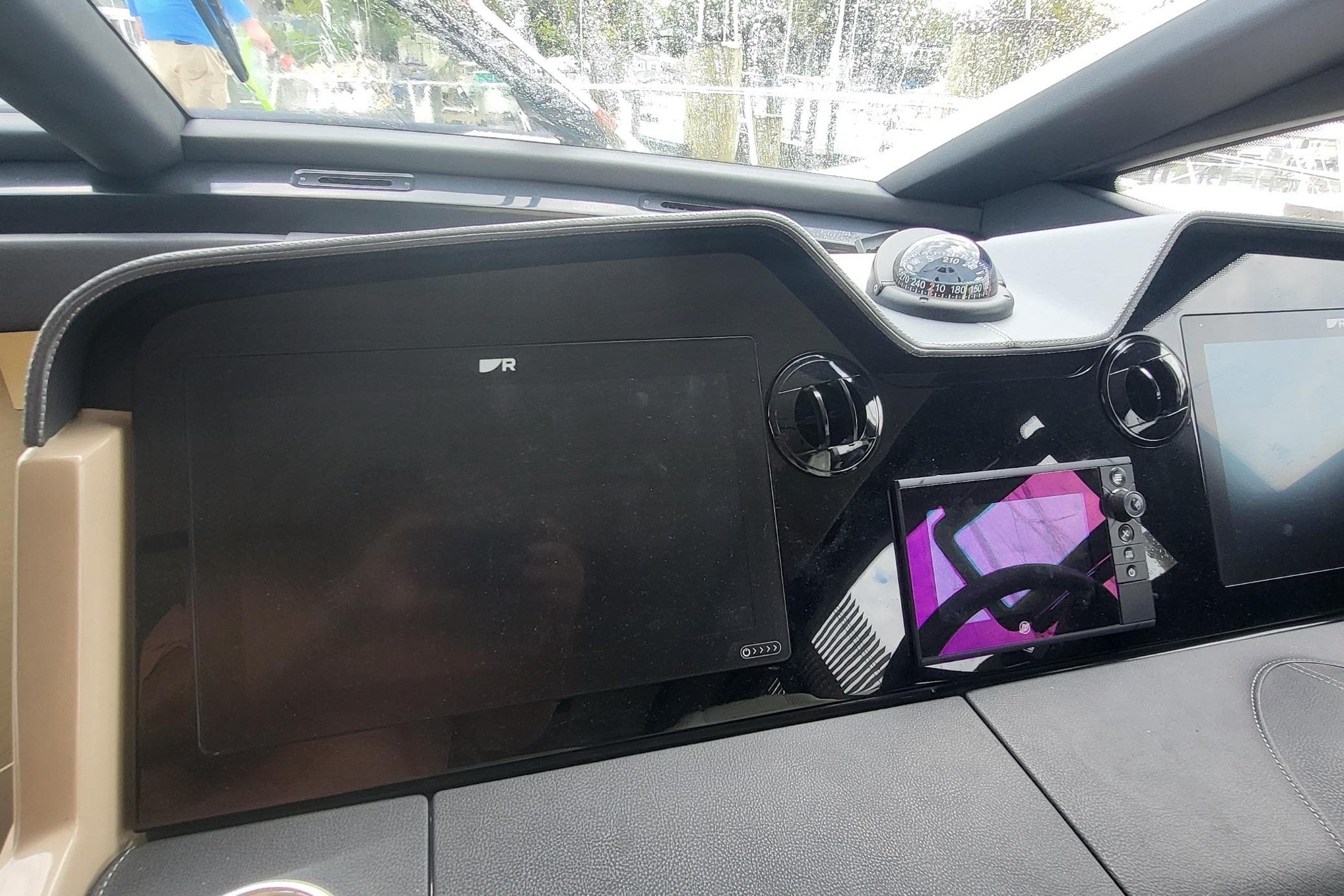 Dashboard of a 2018 Sea Ray L590 Fly yacht with navigation instruments.