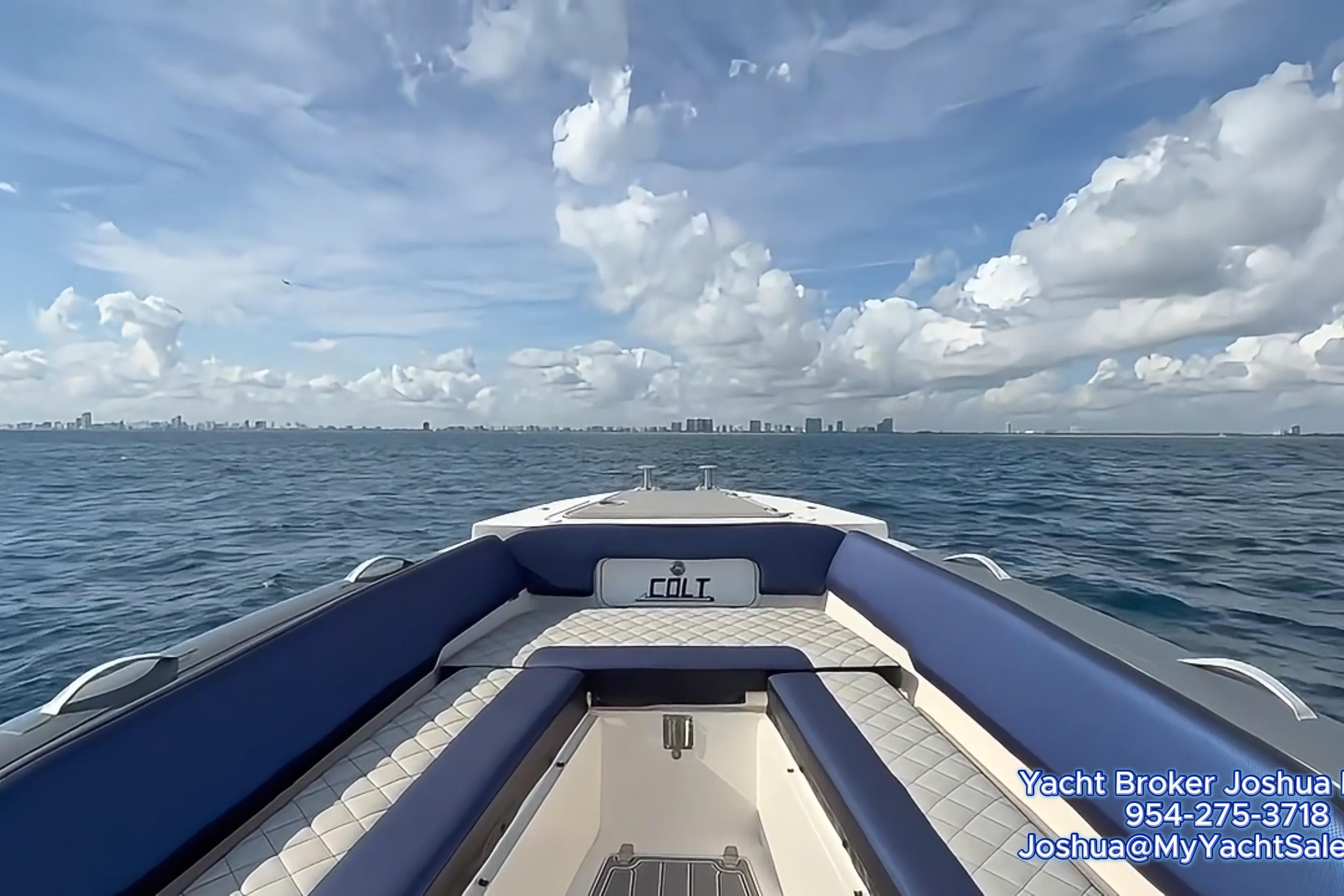 RIB CVL Colt 35 boat on open sea, 2018 model, with city skyline in background.