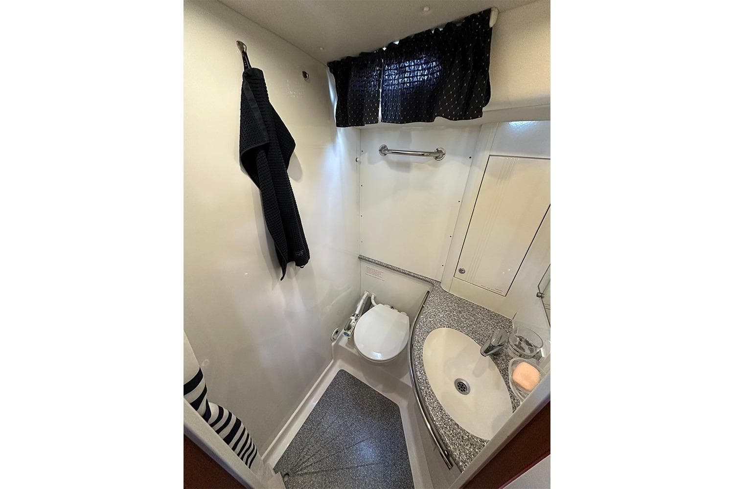 Bathroom interior of 2004 Najad 460 yacht, featuring compact design and modern fixtures.