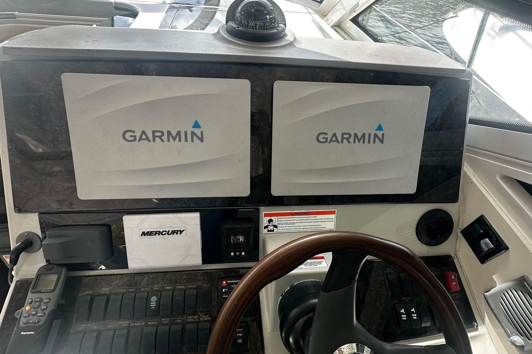Cockpit of 2009 Sea Ray 43 Sundancer with Garmin navigation displays.