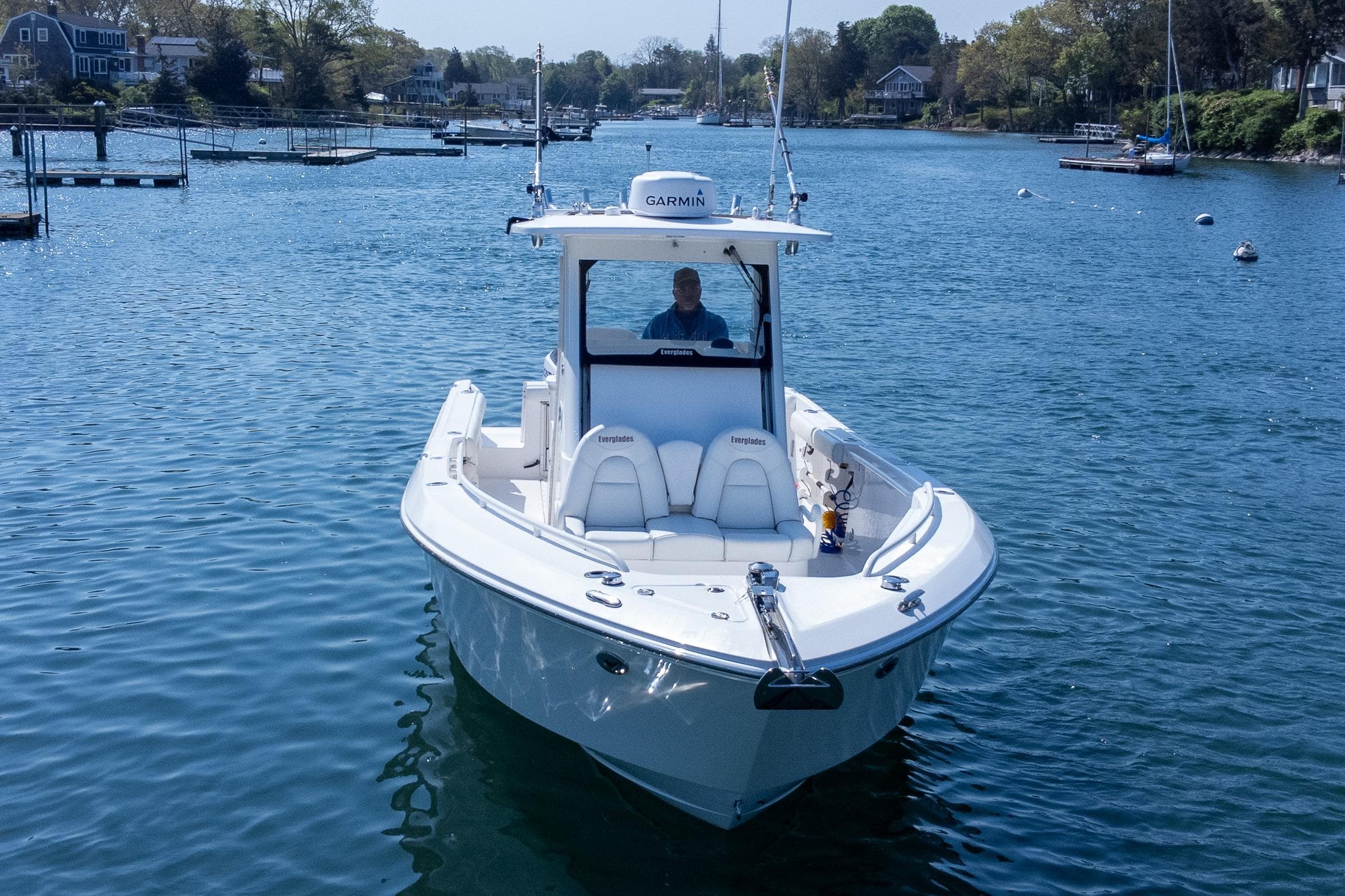 2011 Everglades 295 Center Console boat on calm water, featuring Garmin equipment.