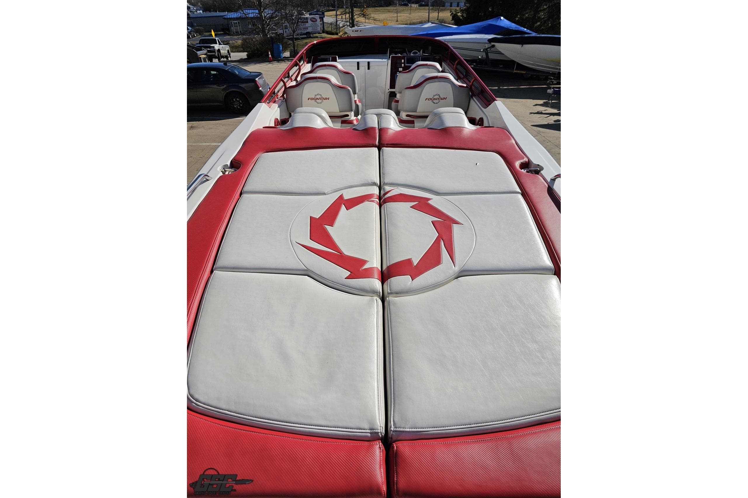2009 Fountain 47 Lightning boat with red and white upholstery, featuring a distinctive logo.