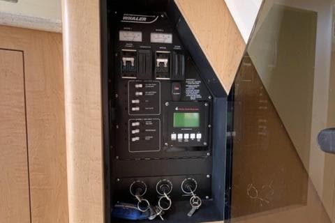 Control panel of a 2012 Boston Whaler 370 Outrage boat with key switches.