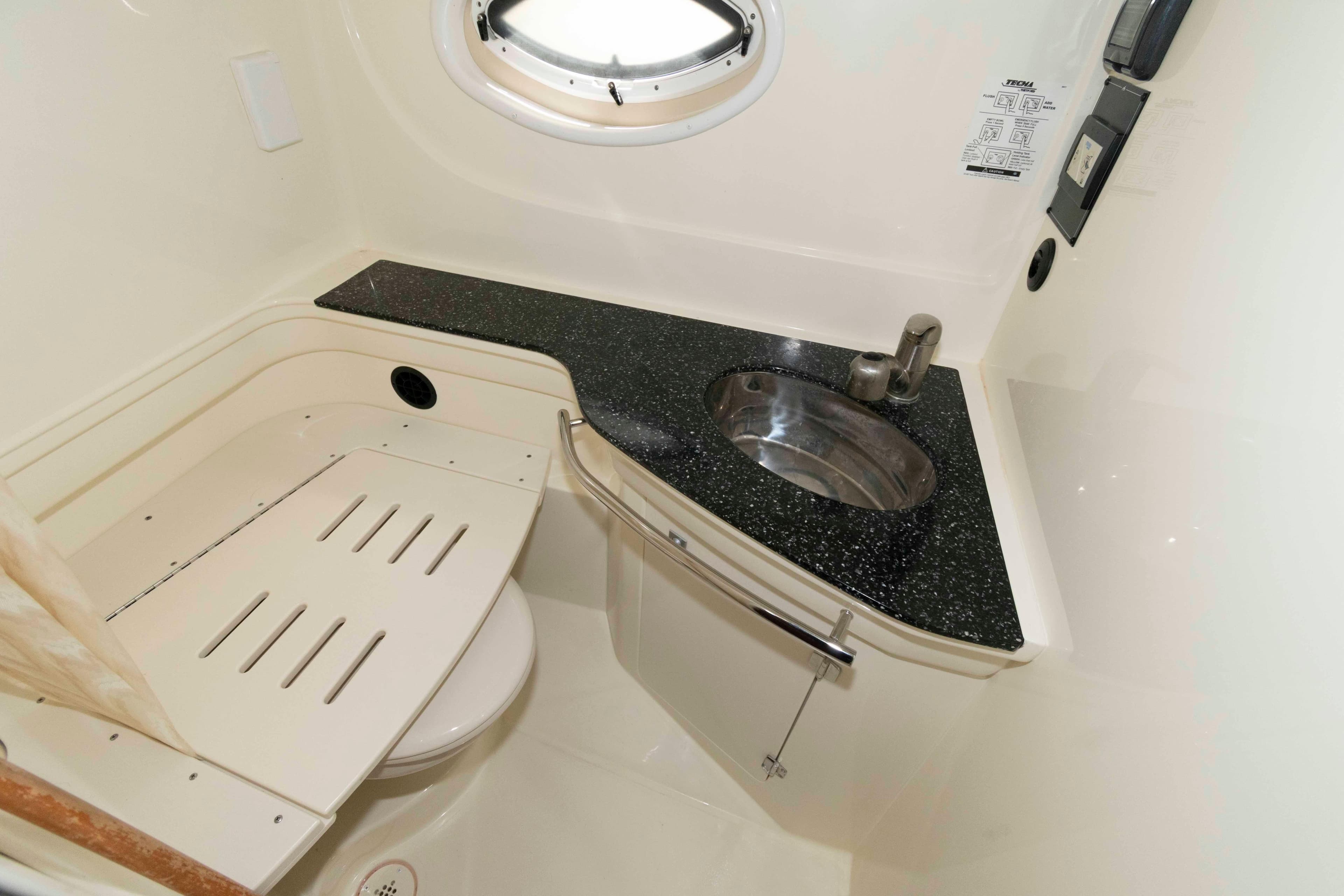 2015 Monterey 355 Sport Yacht bathroom with sleek sink and modern fixtures.