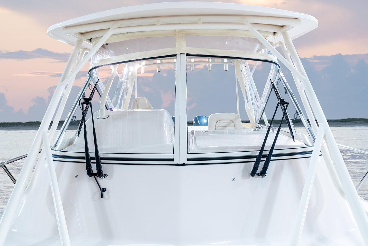Manufacturer Provided Image: Grady-White Marlin 300 boat, 2026 model, on water at sunset.