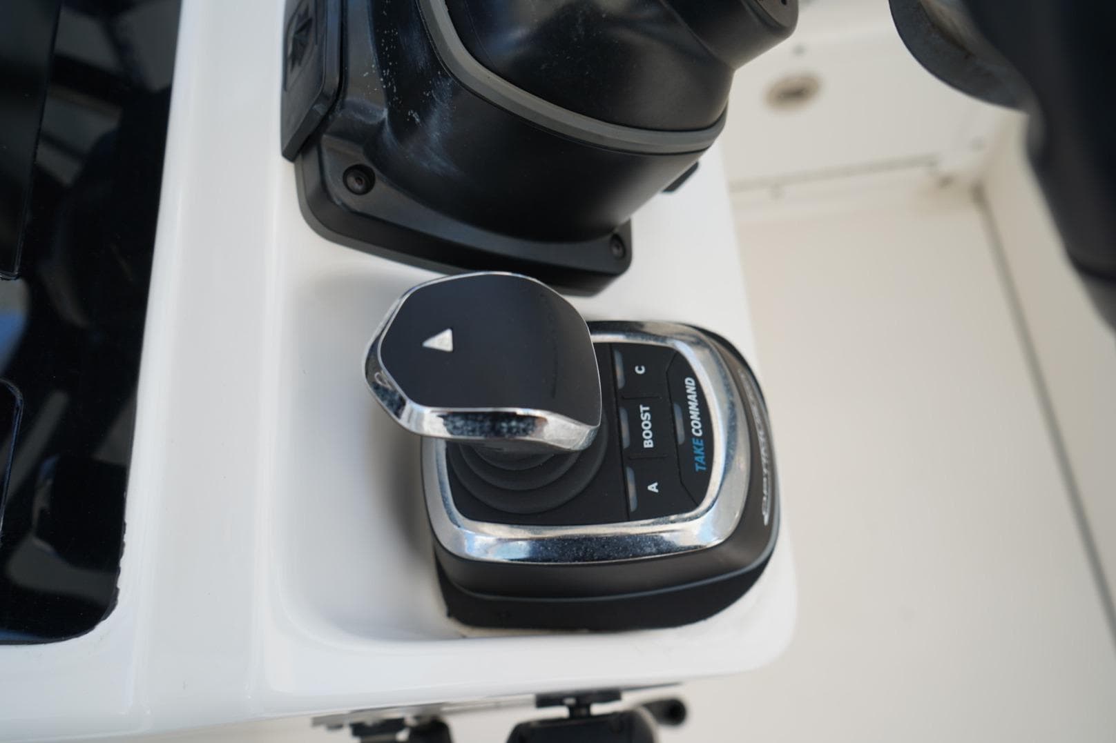 Close-up of 2020 Edgewater 262CX Crossover boat control joystick.