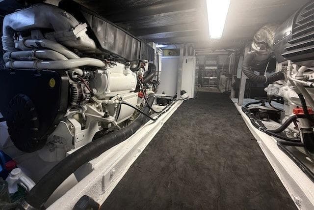 Engine room of a 2007 Navigator 58 yacht, featuring well-maintained machinery and equipment.
