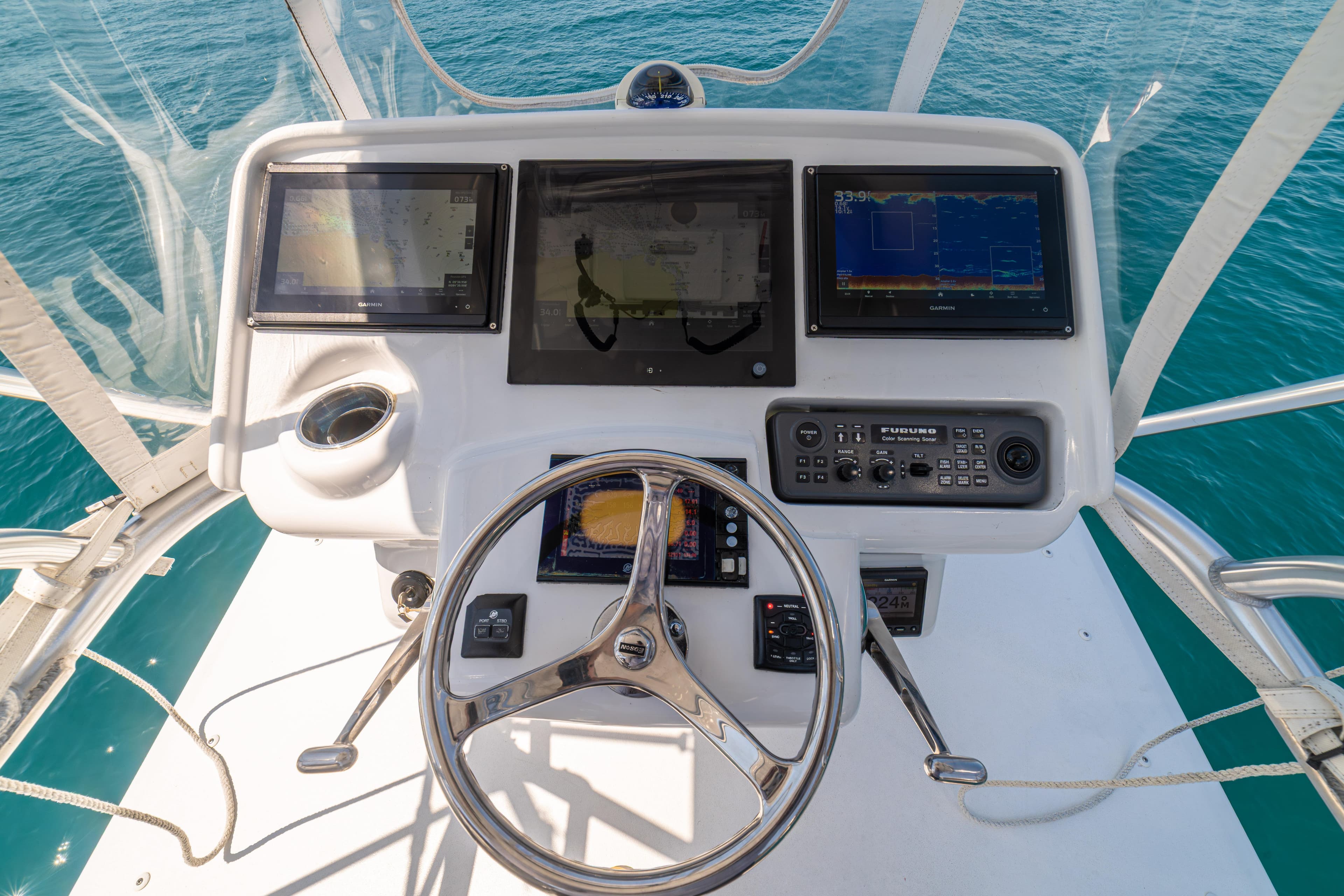 Cockpit of 2018 Maverick Yachts Costa Rica 36 Walkaround with navigation displays and steering wheel.