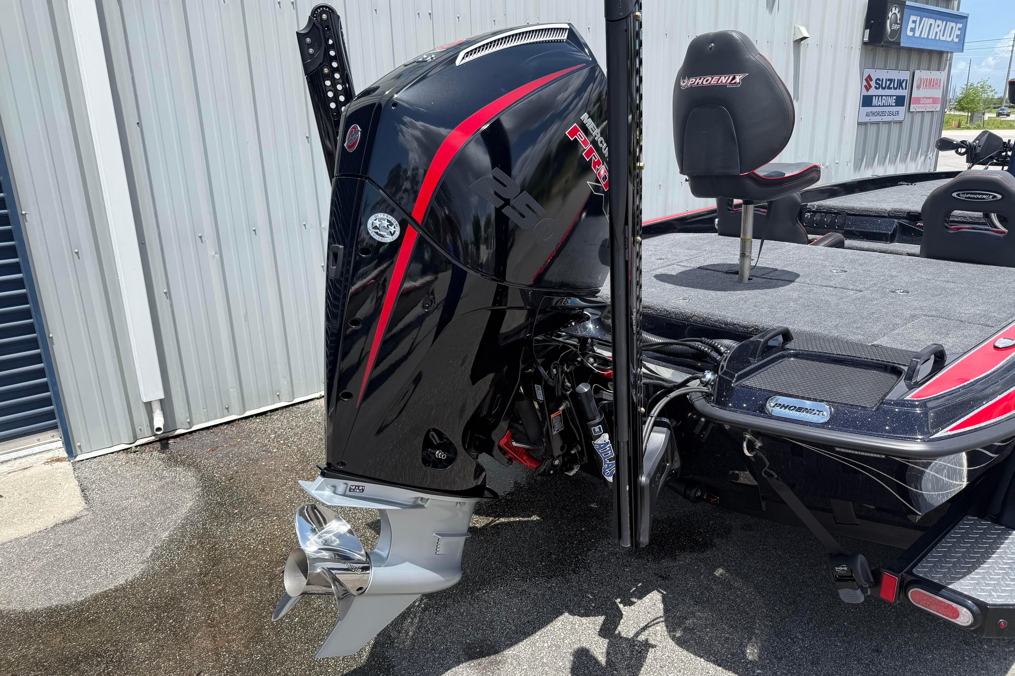 2026 Phoenix 921 Elite X II boat with powerful outboard motor and sleek design.