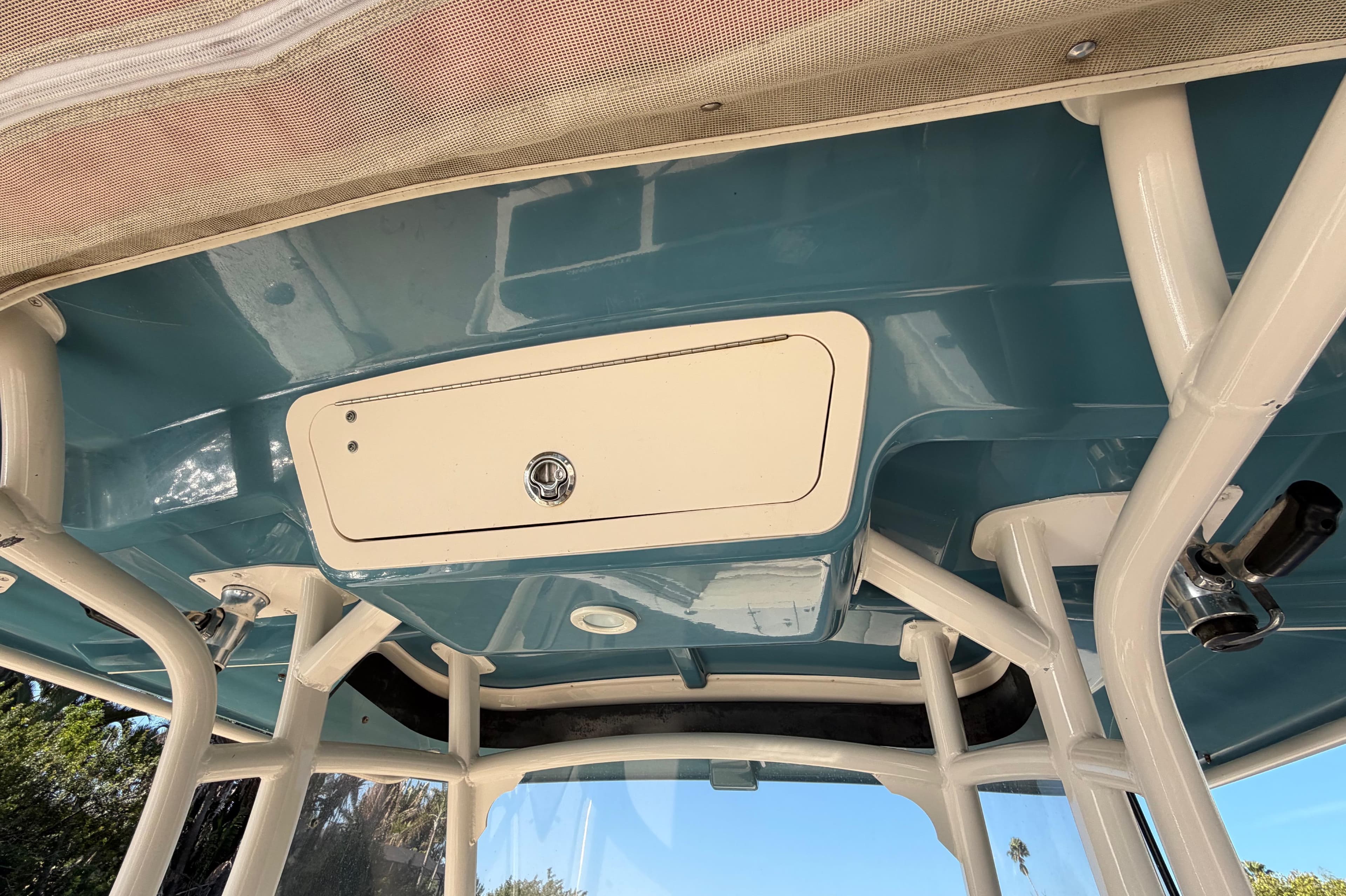 2018 Grady-White Canyon 306 boat interior with storage compartment and rod holders.