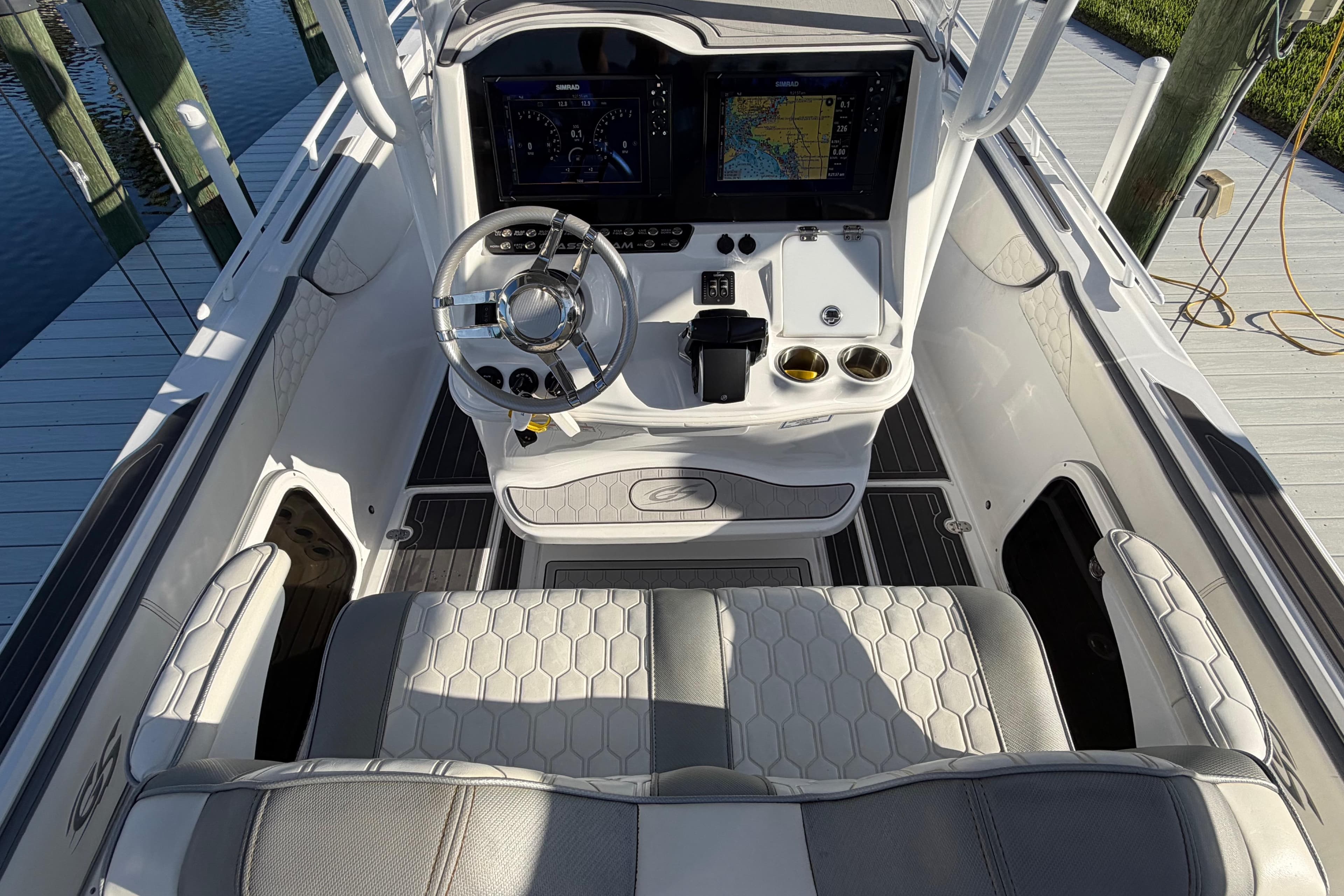 2022 Glasstream 328 Pro-XS boat cockpit with modern steering and navigation displays.