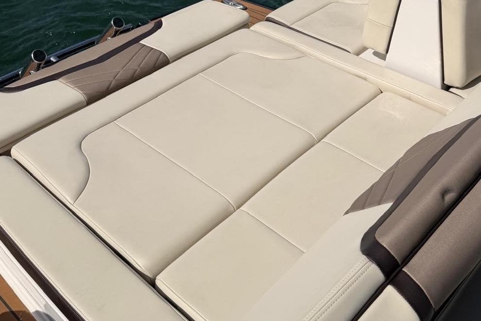 2018 Chaparral 267 SSX boat with luxurious beige seating on deck.