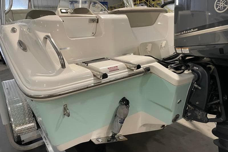 2024 Key West 239 DFS boat with Yamaha outboard motor in a showroom.