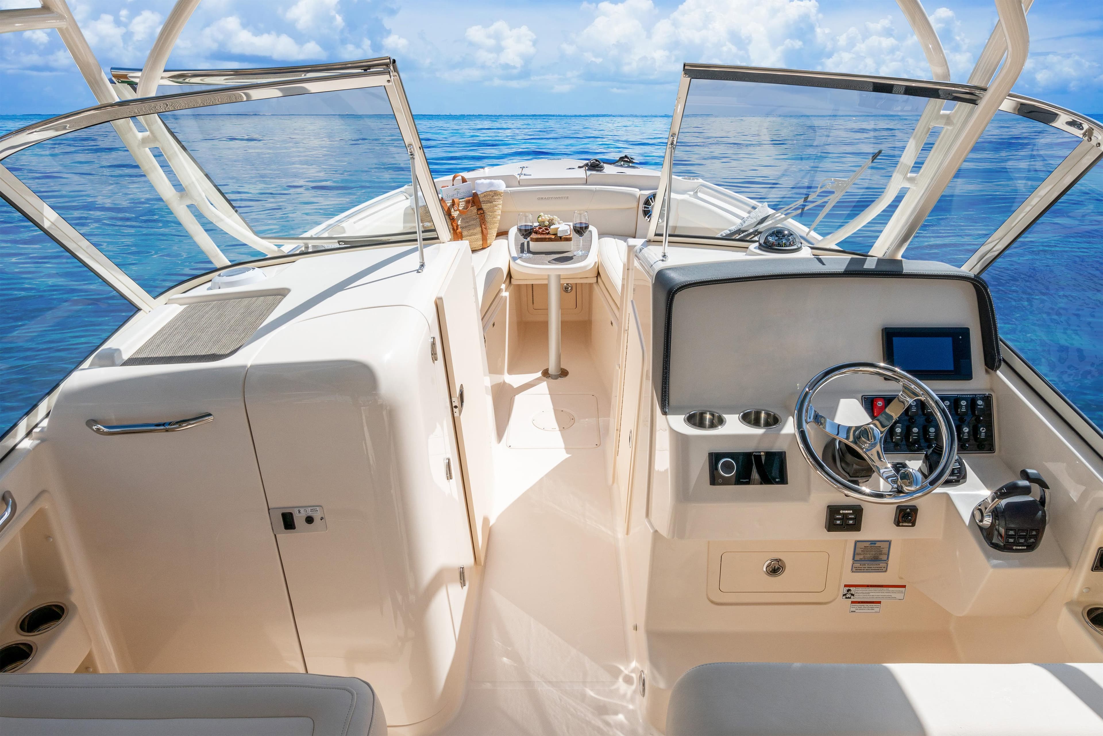 2026 Grady-White Freedom 285 boat interior with steering wheel, ocean view, and open deck.
