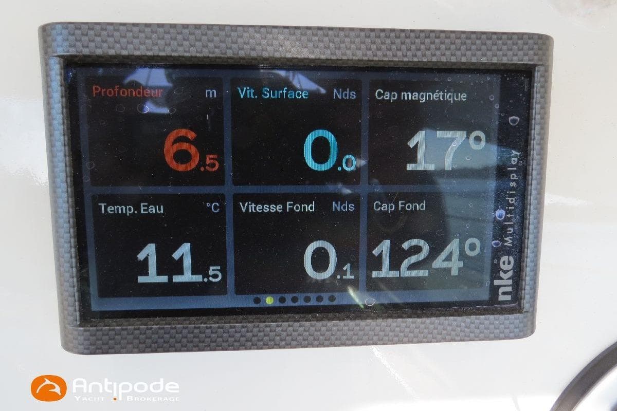 Digital marine display showing depth, speed, water temperature, and compass readings on a Meta JPB 52.