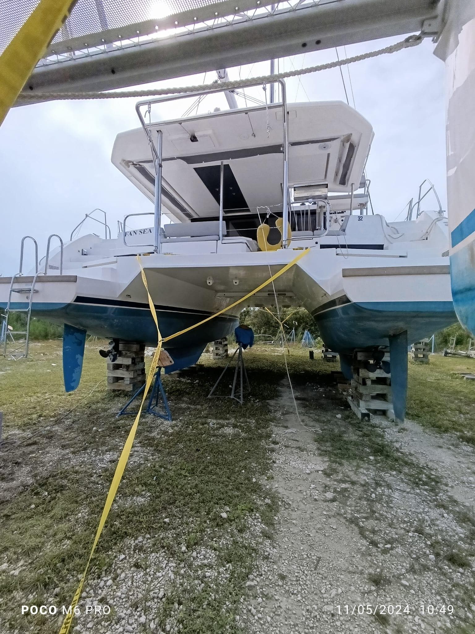 2020 Leopard 45 catamaran on land, supported by blocks, with visible hull and deck.