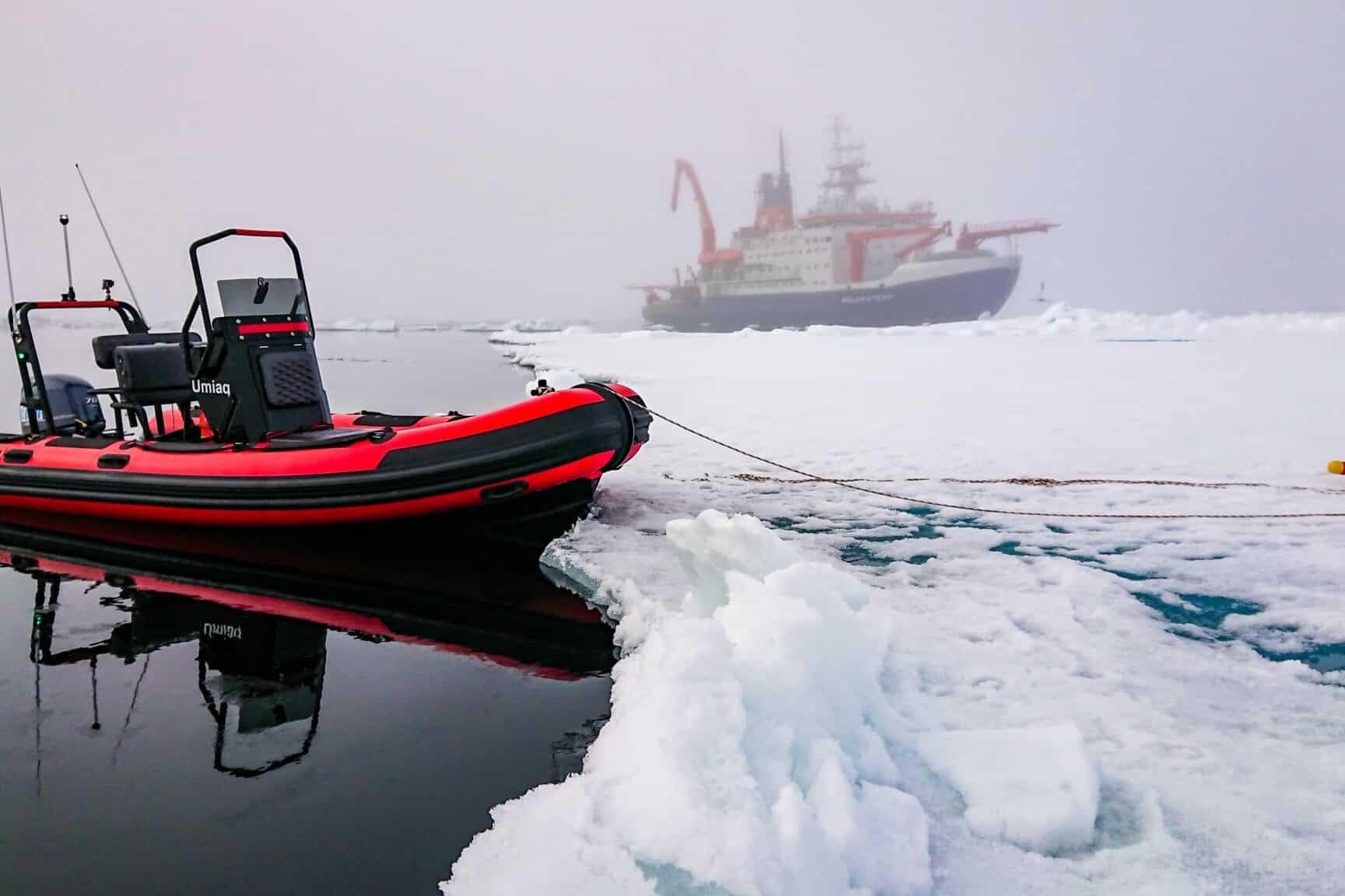Highfield Patrol 500 in ice, 2026, with ship in background.