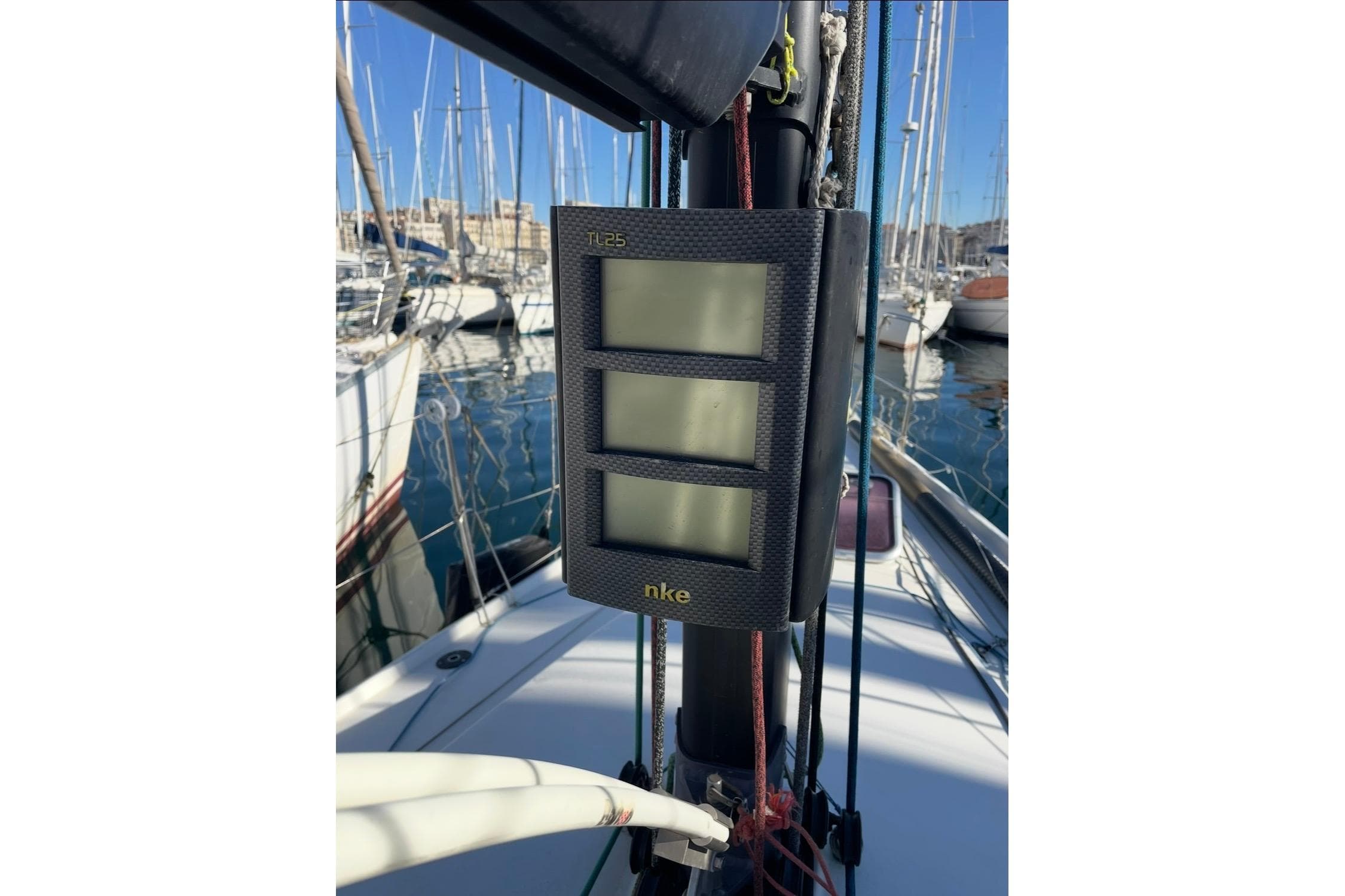Sailing instrument display on a 2008 JPK 998 yacht, docked at a marina.