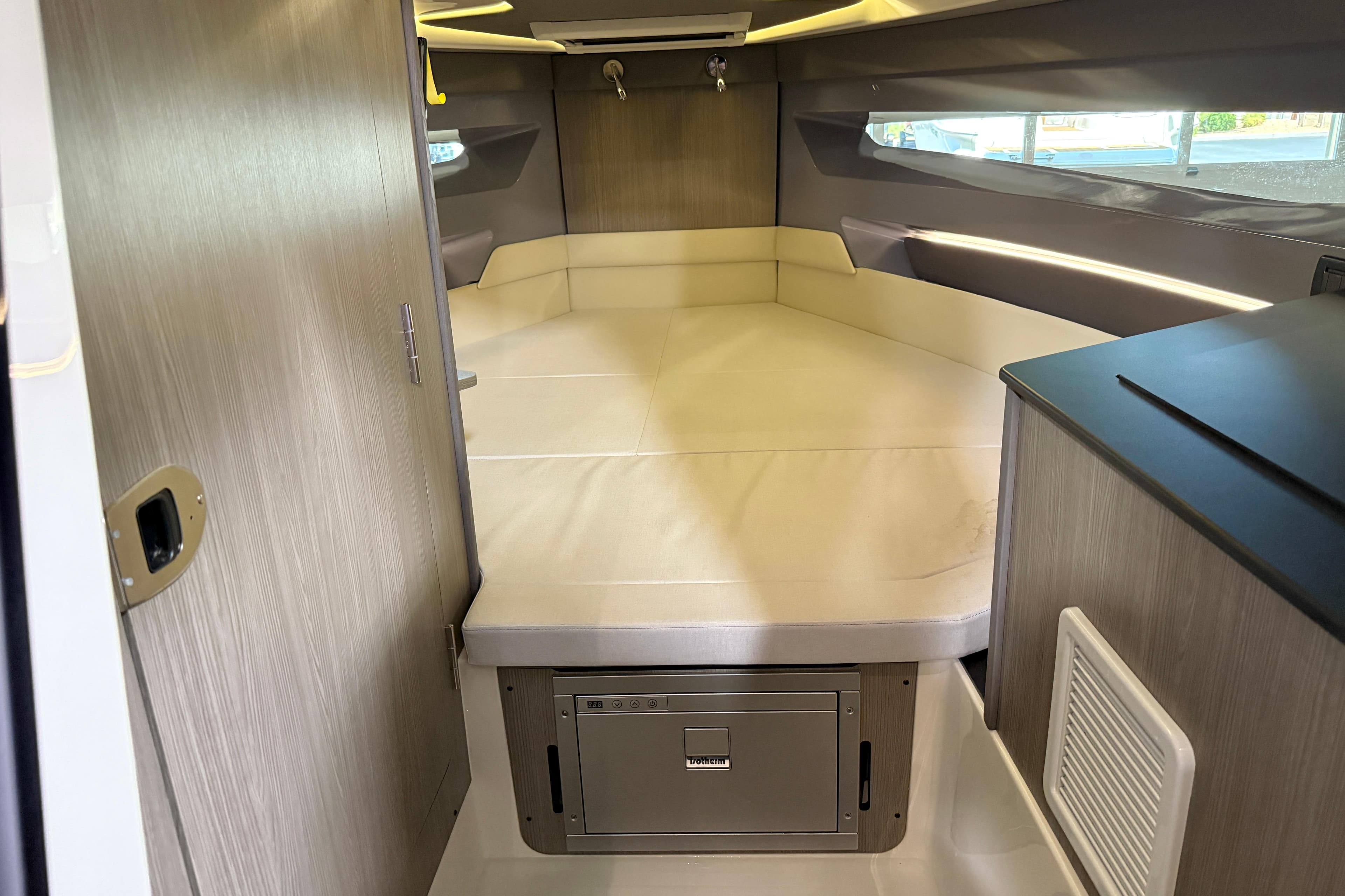 Interior of 2026 Navan S30 boat with modern cabin and cozy sleeping area.