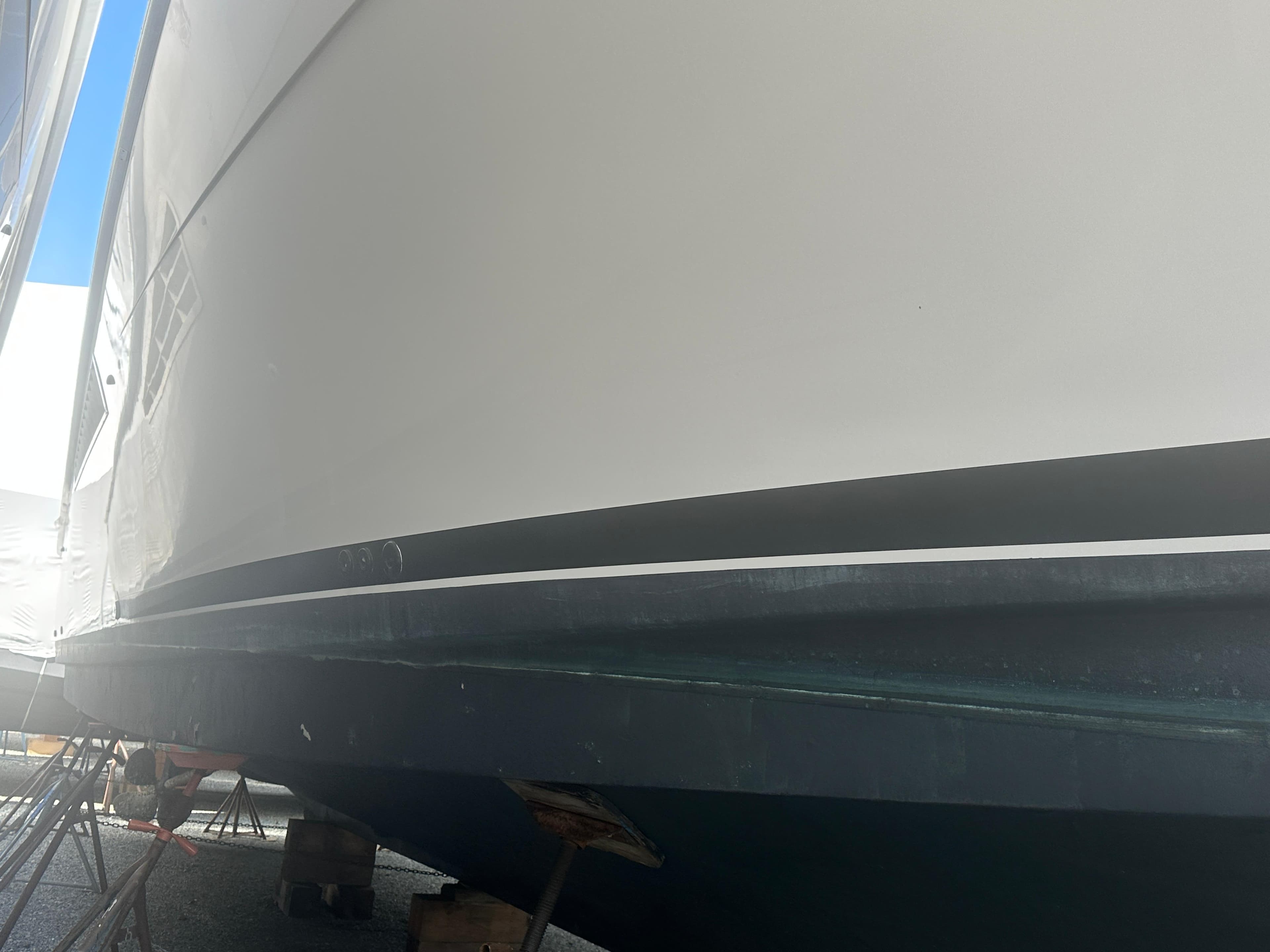 1998 Viking 53 Convertible yacht hull in dry dock, side view.
