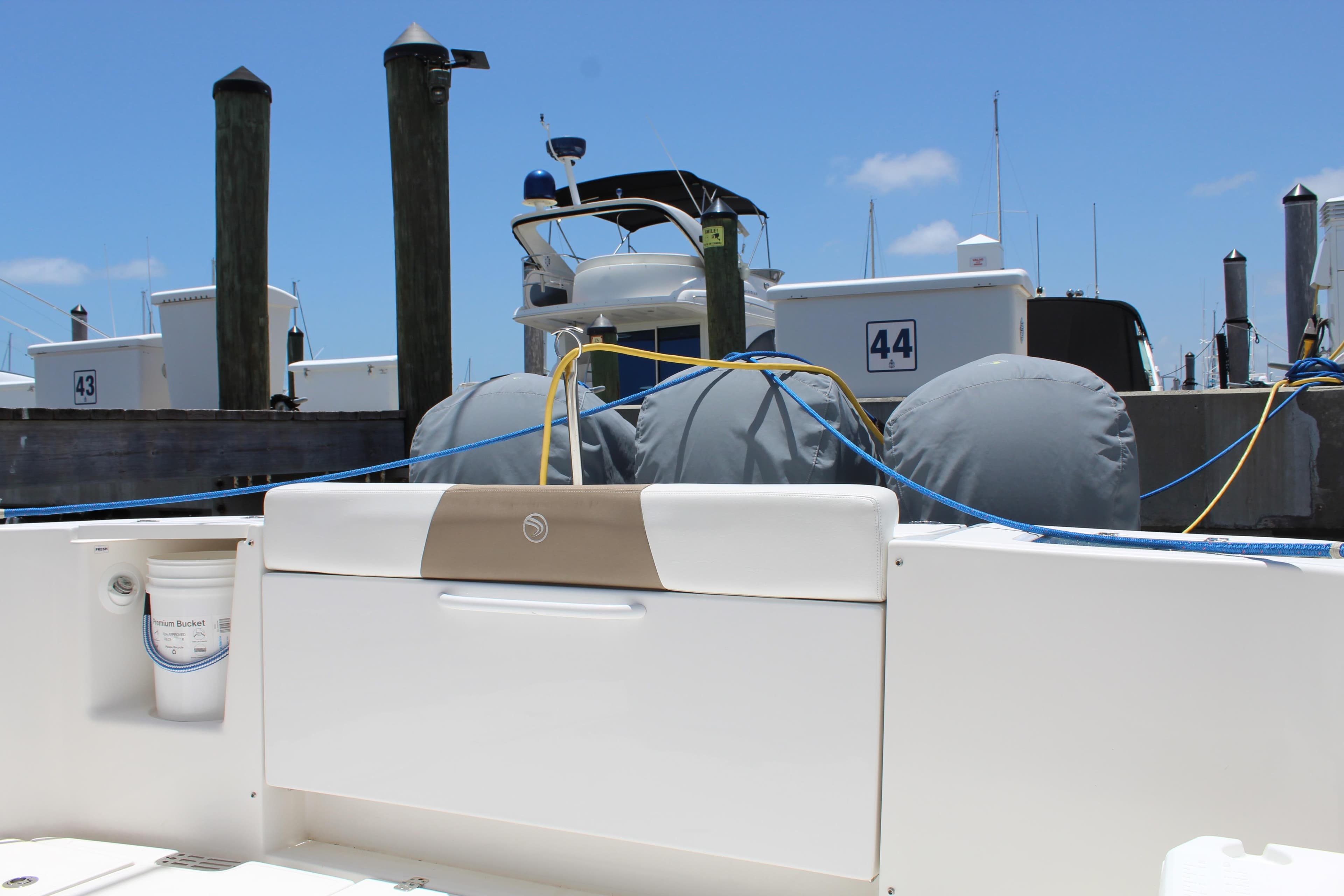 2016 Edgewater 370CC boat docked at marina with blue skies.