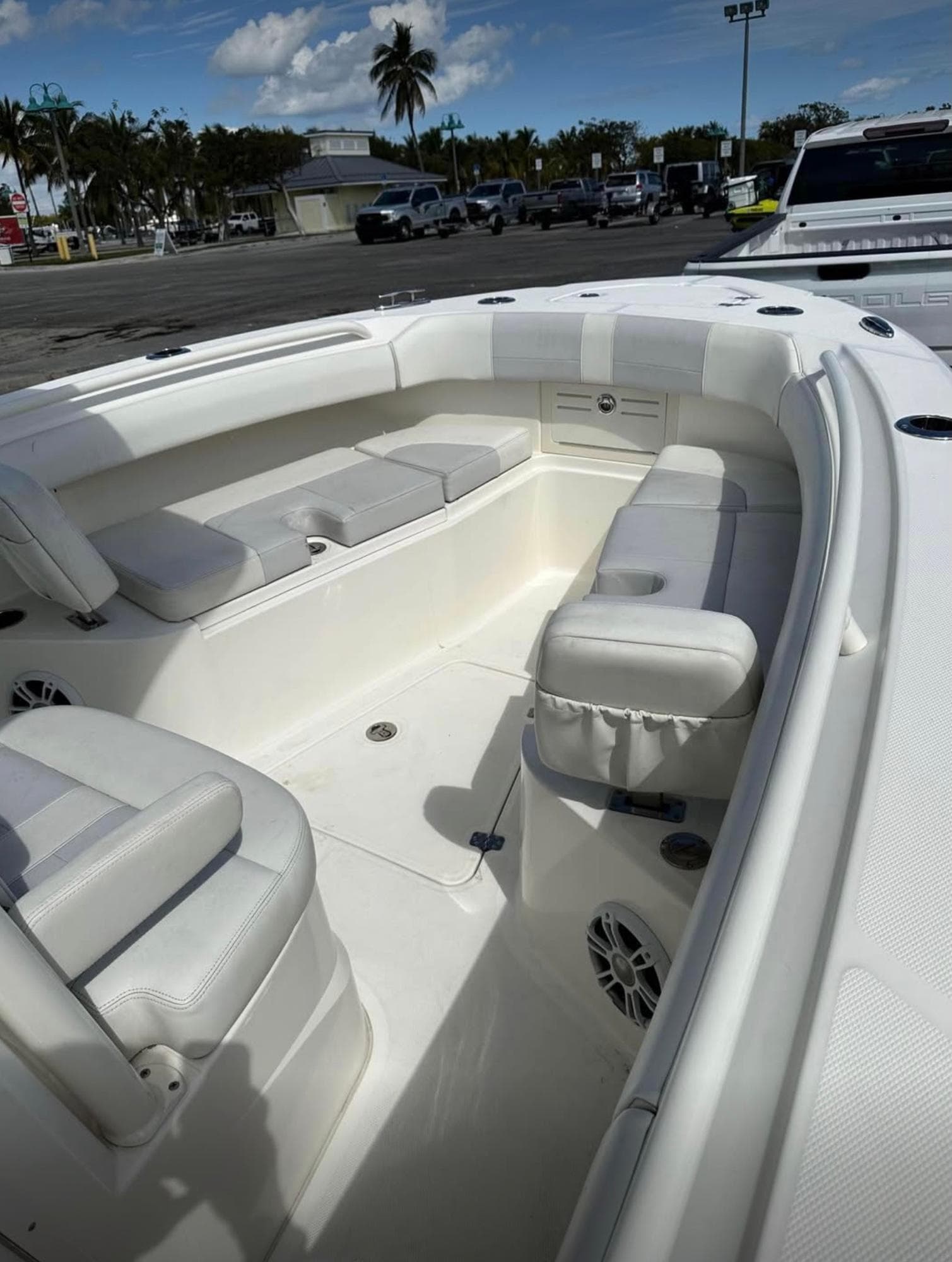 2020 Mako 236 CC boat interior with white seating and open deck.