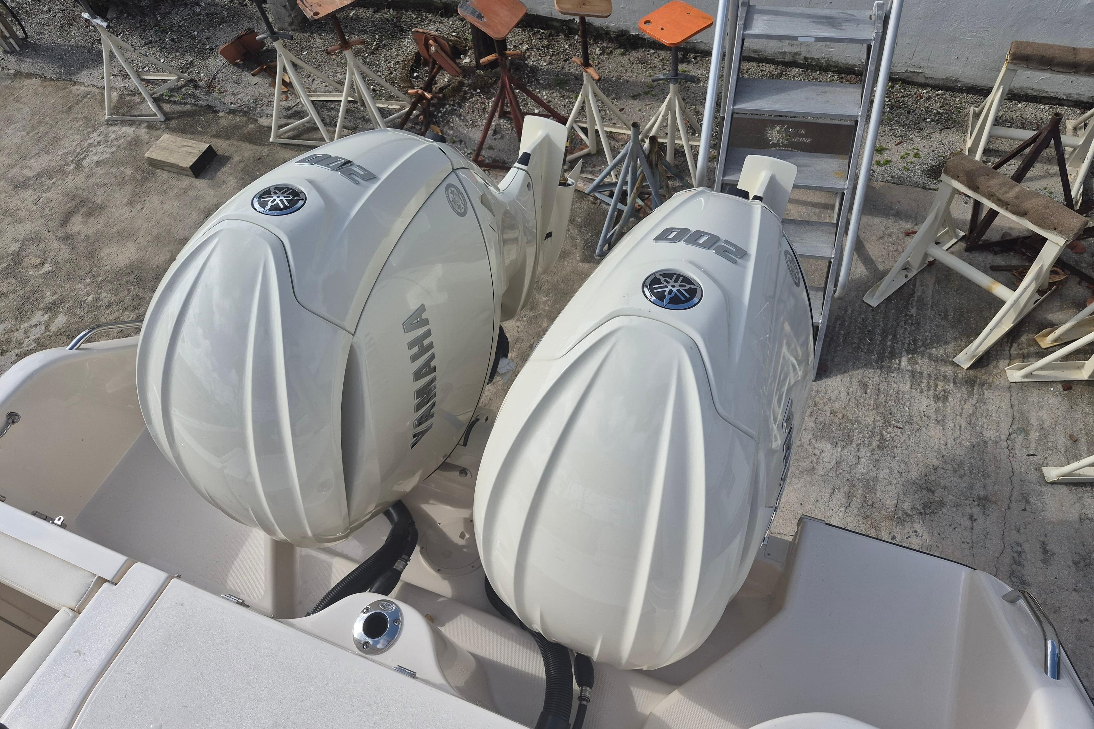 Twin Yamaha outboard engines on a 2026 Grady-White Freedom 275 boat, dockside view.