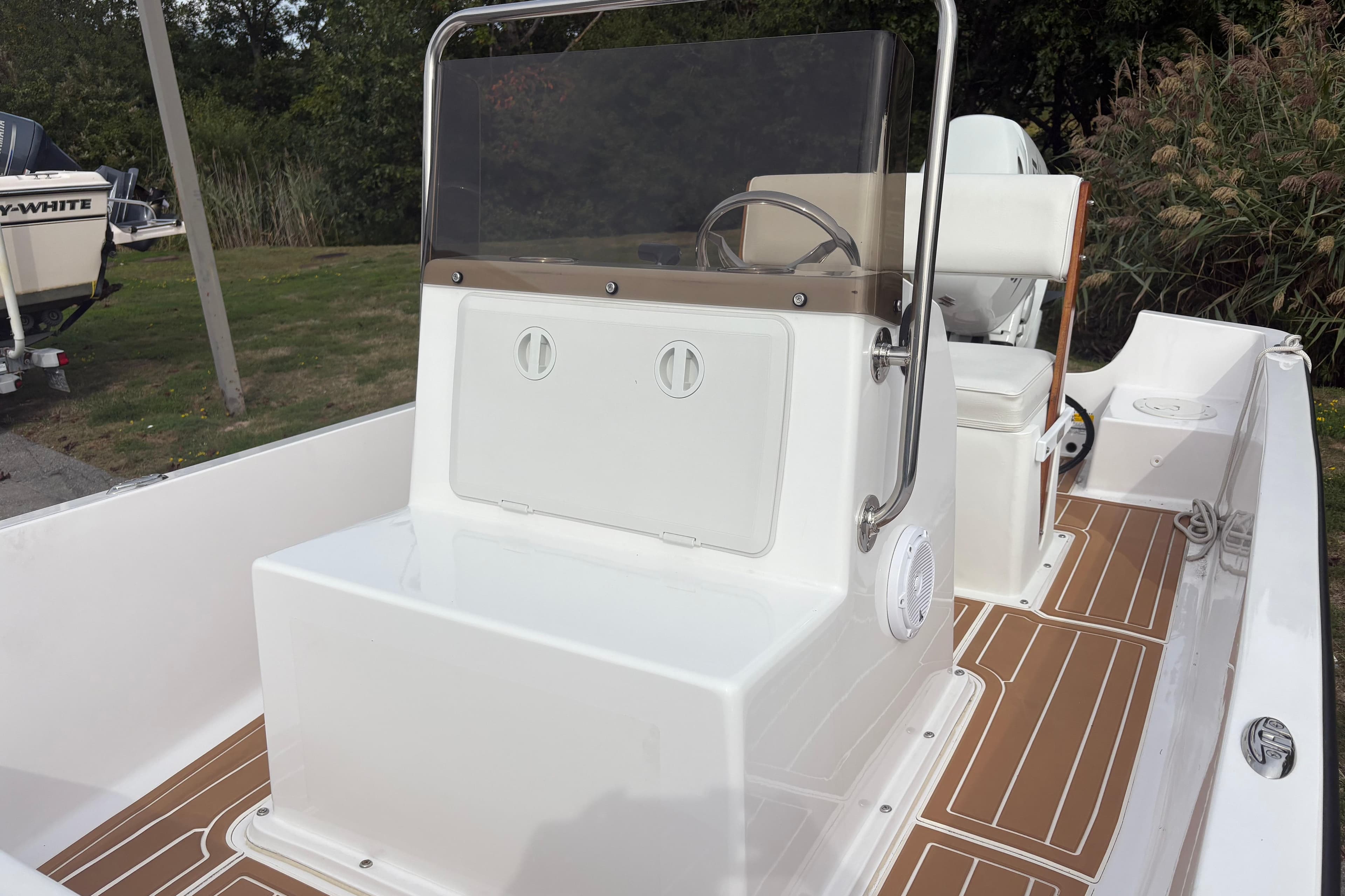 2024 Wolfeboro 15 Classic boat interior with sleek console and seating.