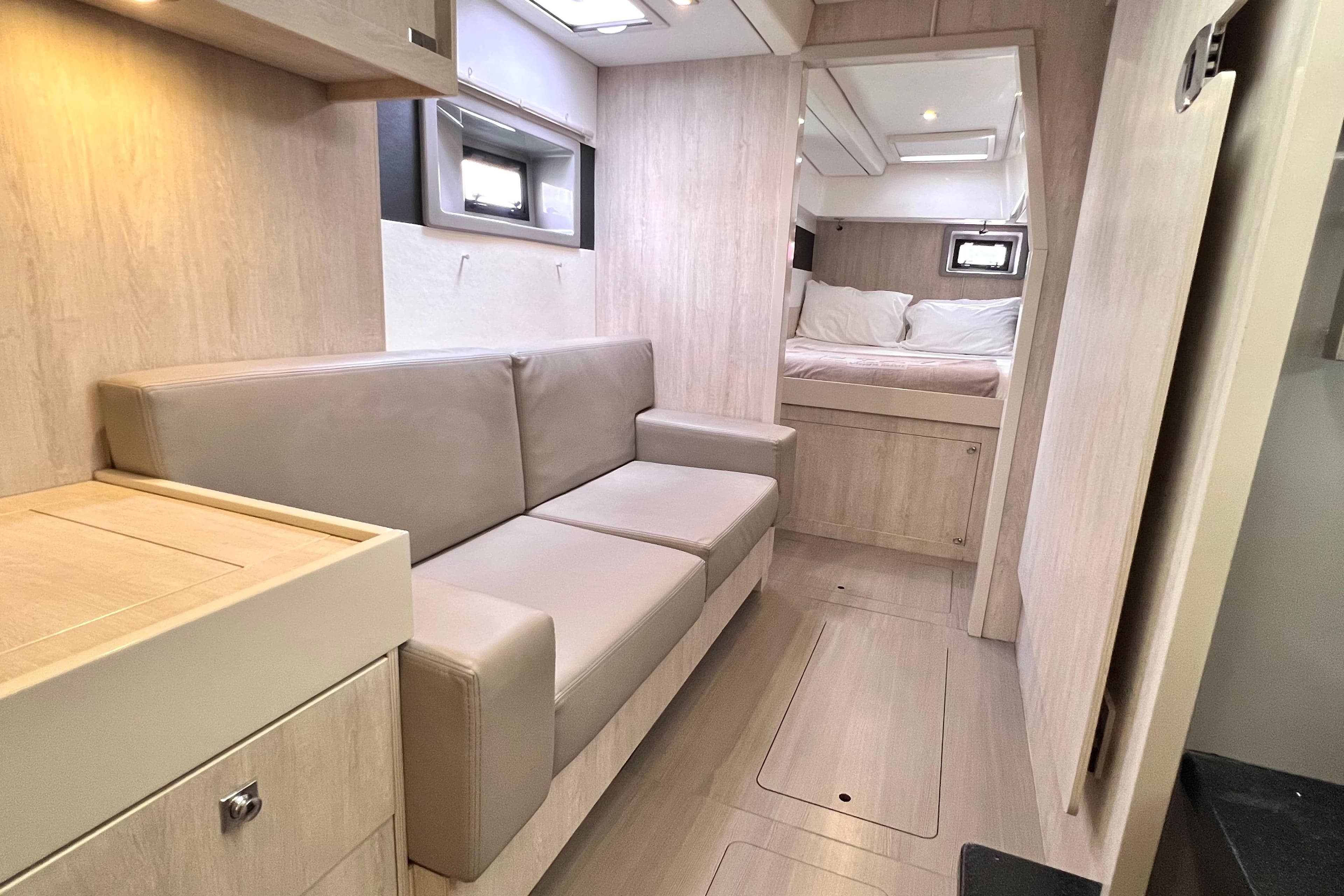 2019 Leopard 51 Powercat interior with modern seating and cozy sleeping area.