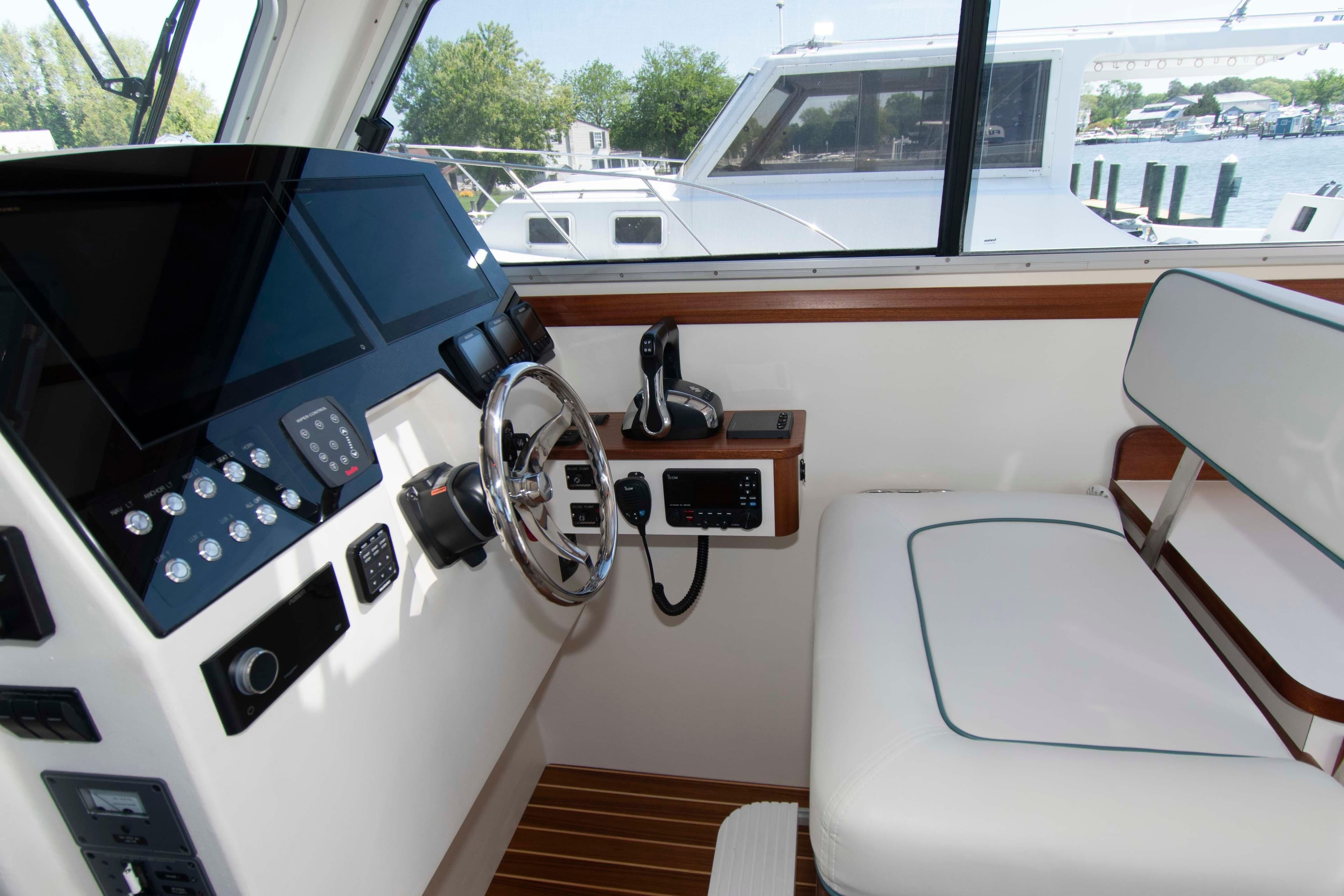 Interior helm of 2024 Composite Yacht CY 42 with modern controls and seating.