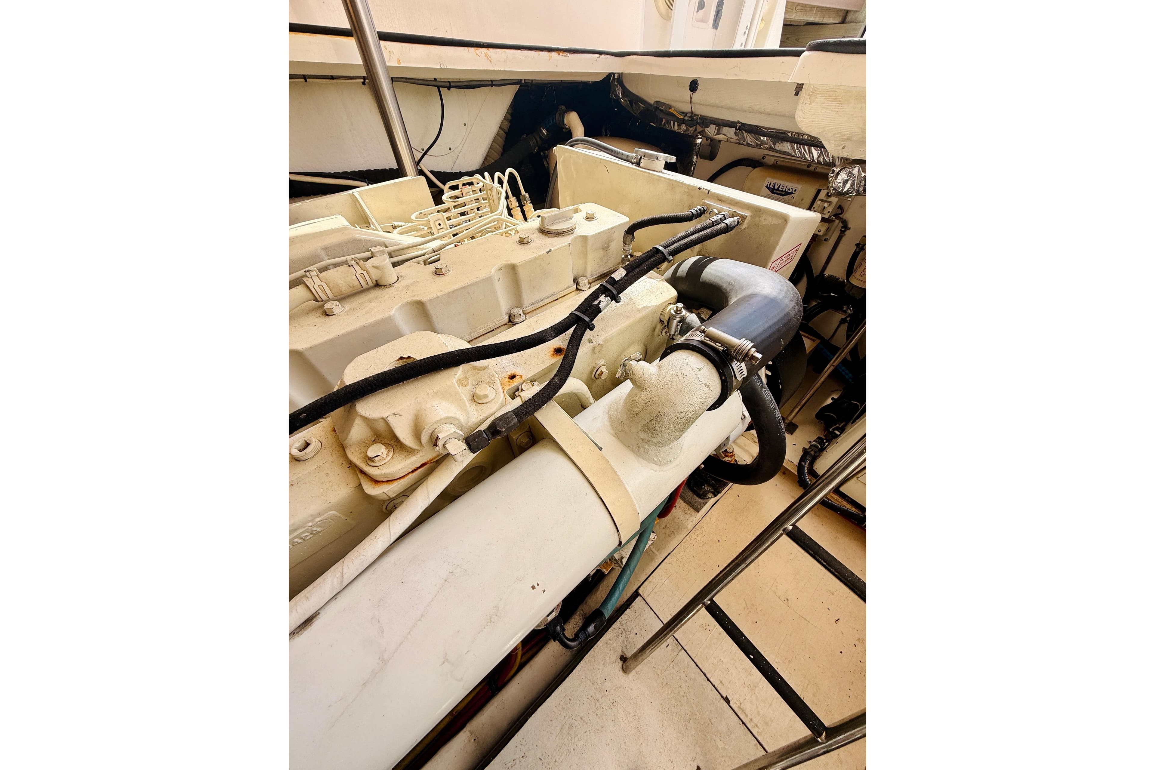Engine compartment of a 2005 Tiara Yachts 3600 Sovran, showcasing mechanical components.