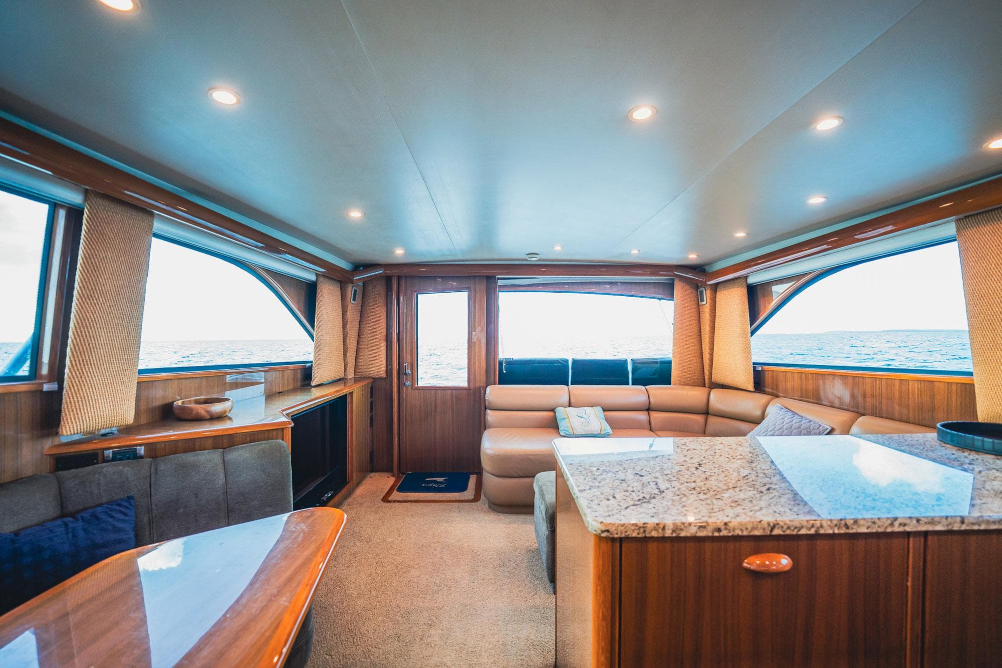 Luxurious interior of a 2005 Viking 48 Convertible yacht with elegant wood finishes.