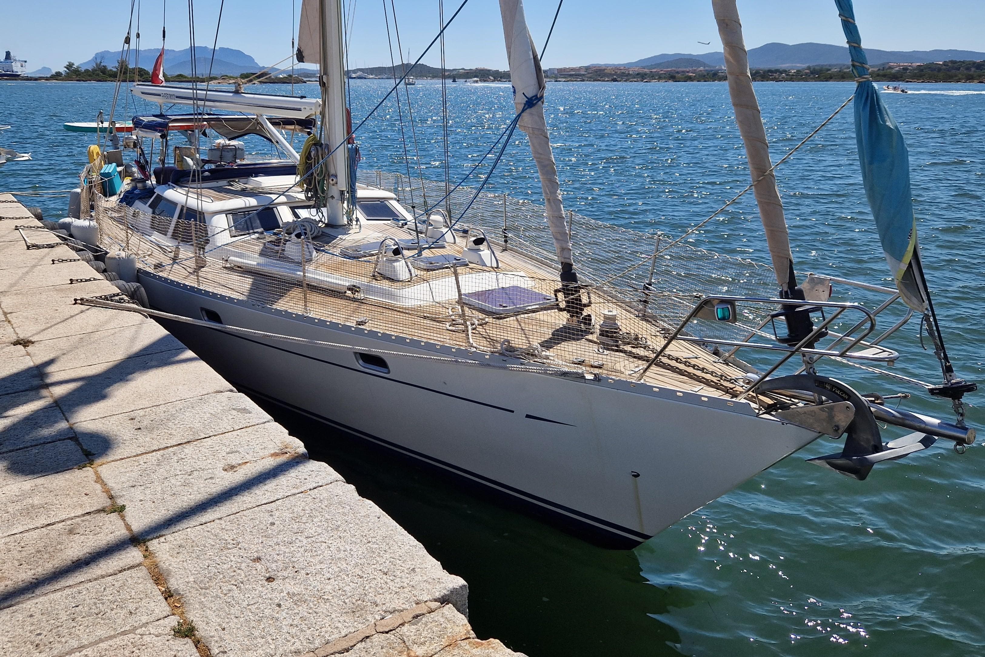 Sailing yacht Oyster 55, 1995 model, docked at a sunny marina.