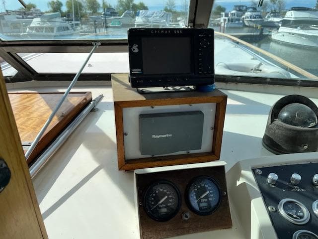 1977 Hatteras 43 Double Cabin helm with navigation instruments and gauges.