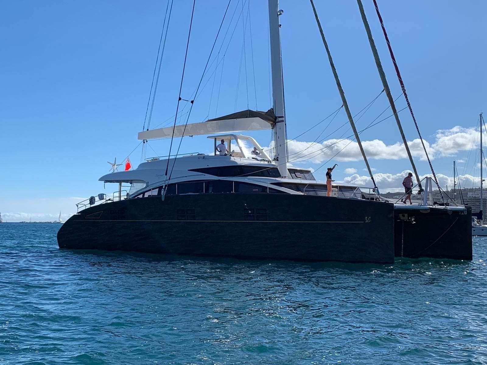 Luxury Sunreef 82 DD catamaran yacht sailing on open water, 2012 model.
