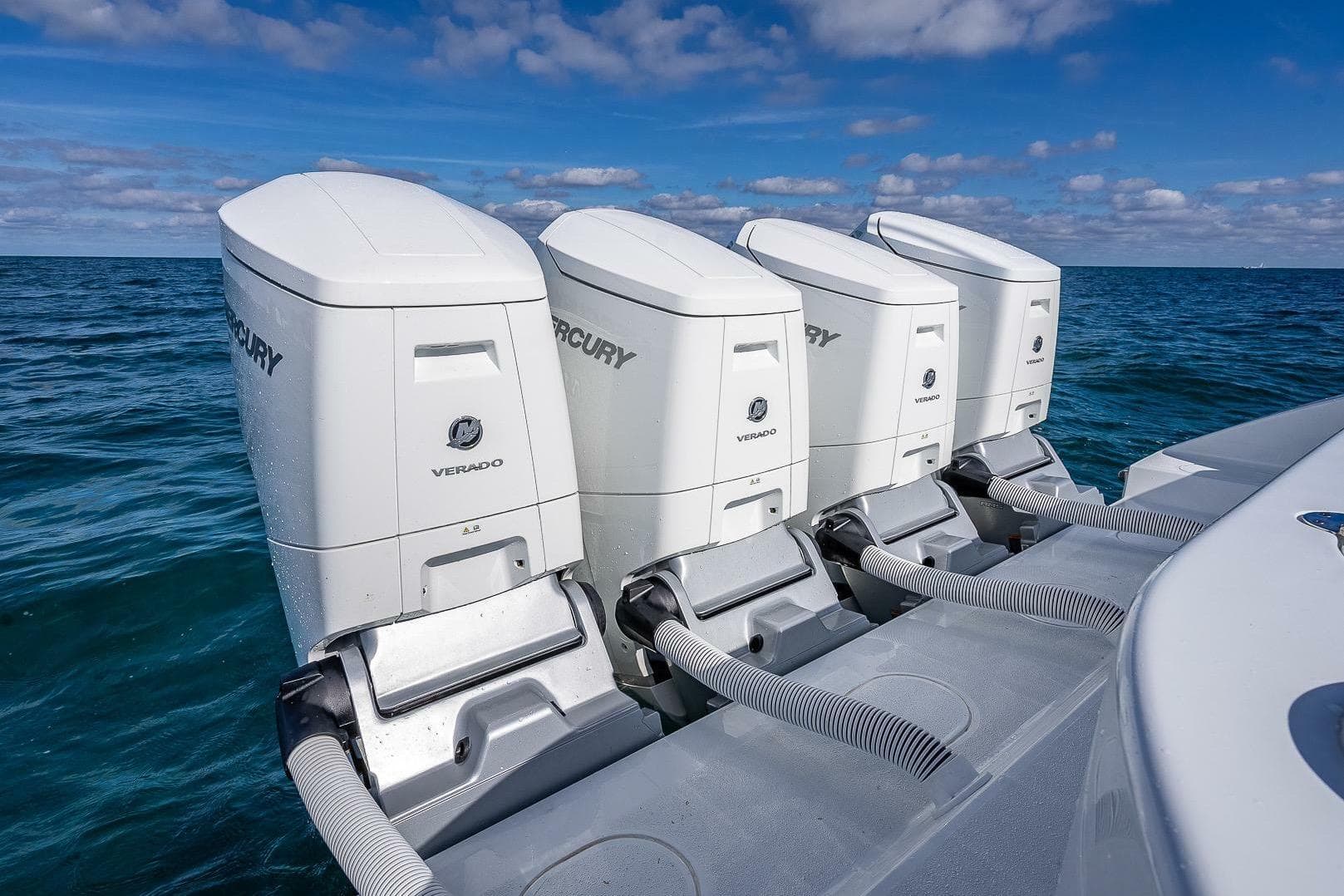 2024 Yellowfin 54 Offshore boat with four Mercury Verado outboard engines on open water.